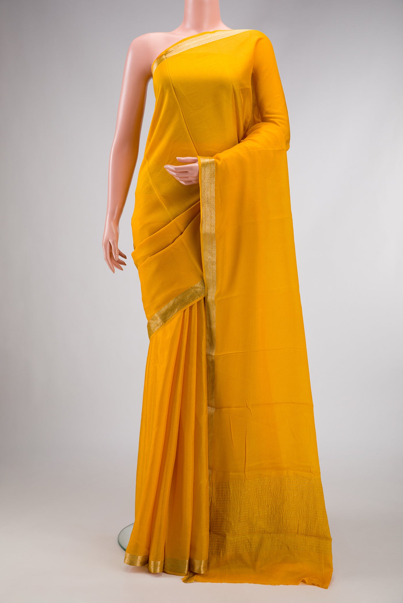 Yellow Dual Tone Mysore Georgette Saree with Plain Body and Zari Border.  displayed on a mannequin