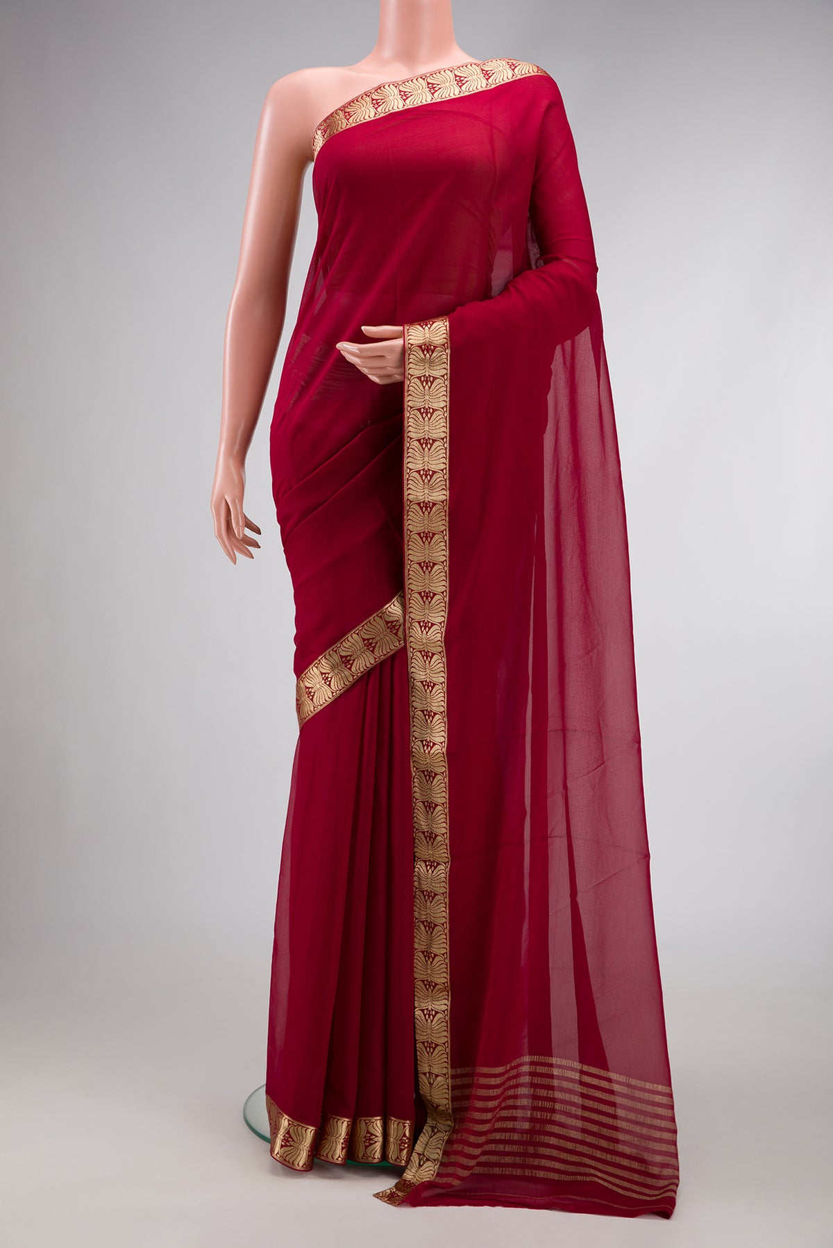 Maroon Dual Tone Mysore Georgette Saree with Plain Body and Zari Border.  displayed on a mannequin