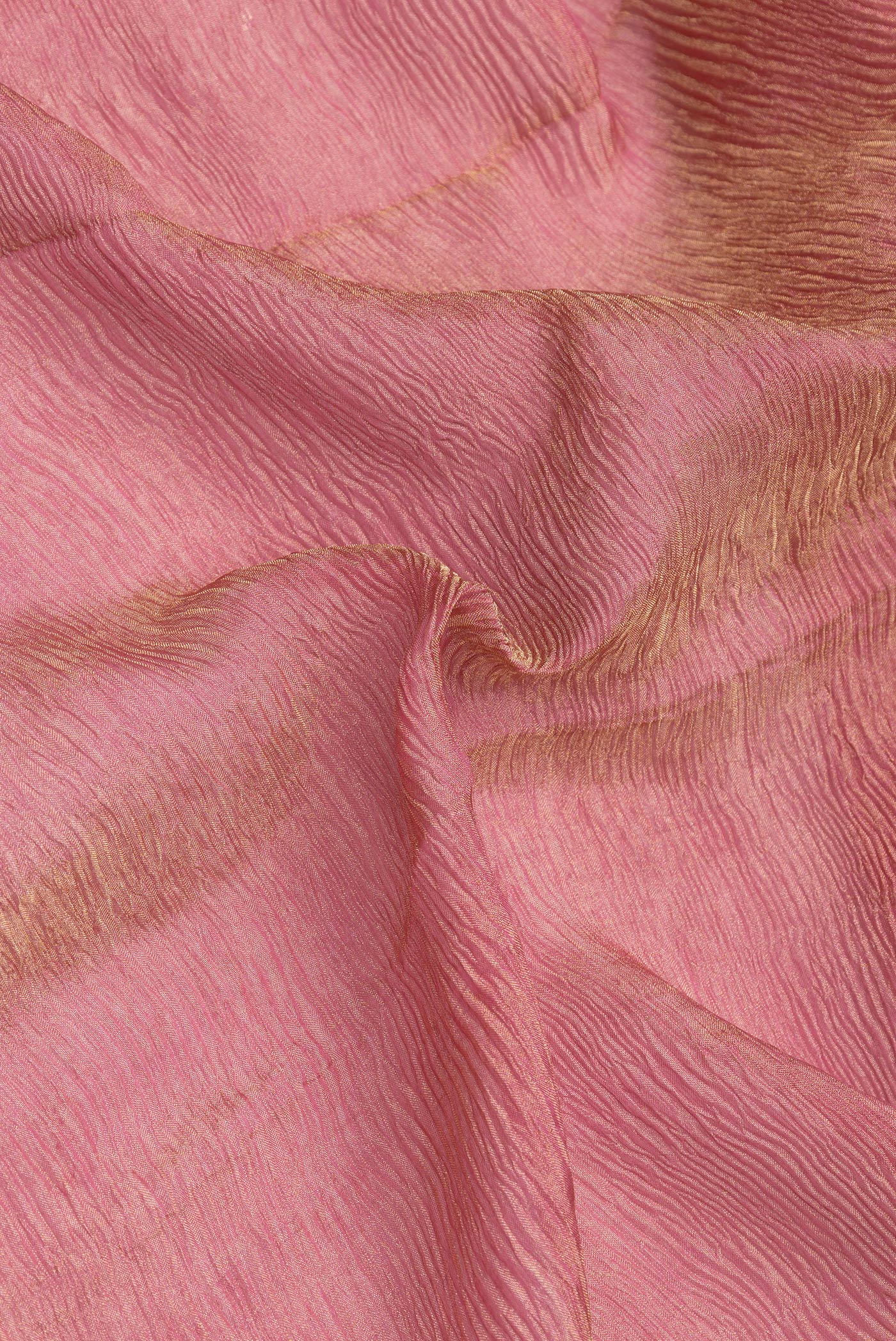 Close up of Pink Dual Tone Mysore Georgette Saree with Plain Body and Zari Border.  displaying folds