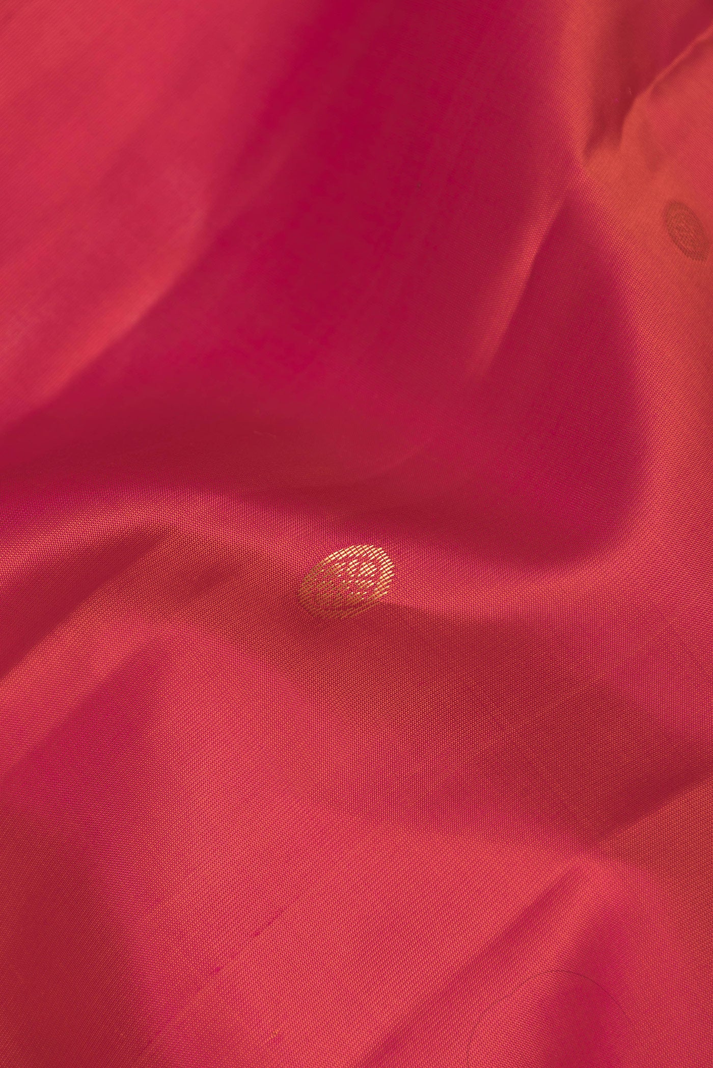 Close up of Pink Dual Tone Kanjivaram Silk Saree with Zari Butta on the body and Zari Border.  displaying folds