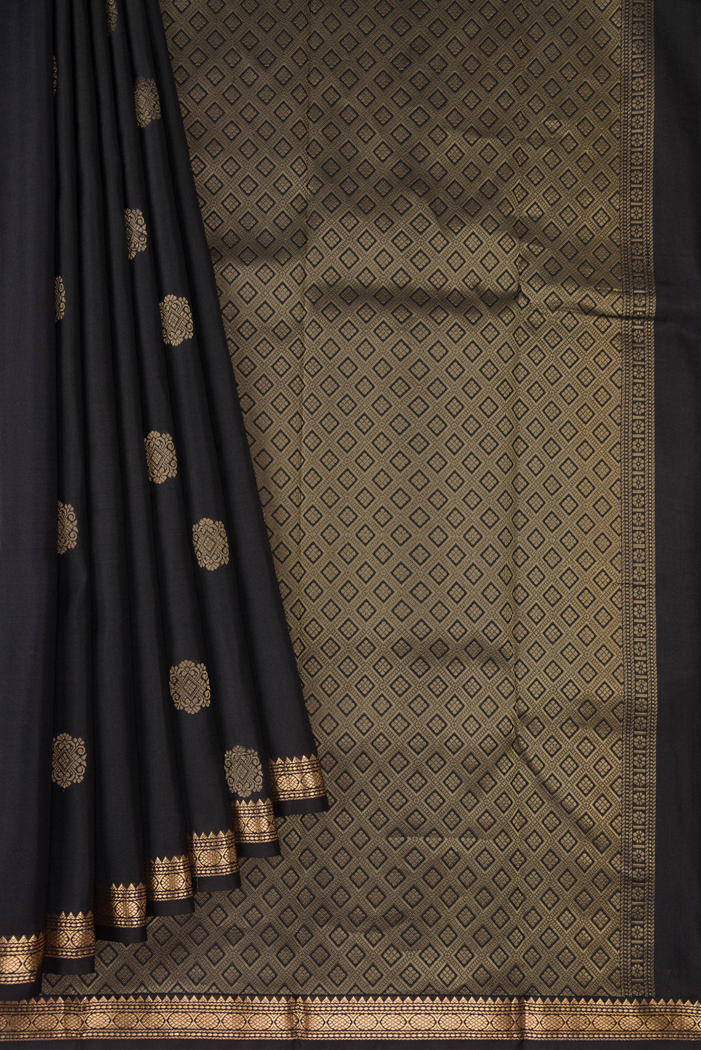 Pleats and pallu of Black Dual Tone Kanjivaram Silk Saree with Zari Butta on the body and Zari Border. 
