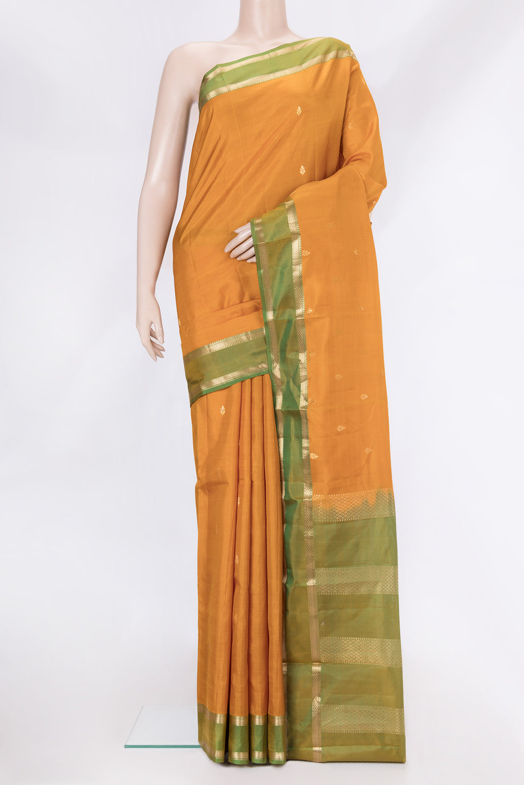Mustard Dual Tone Kanjivaram Silk Saree with Zari Butta on the body and Zari Border.  displayed on a mannequin