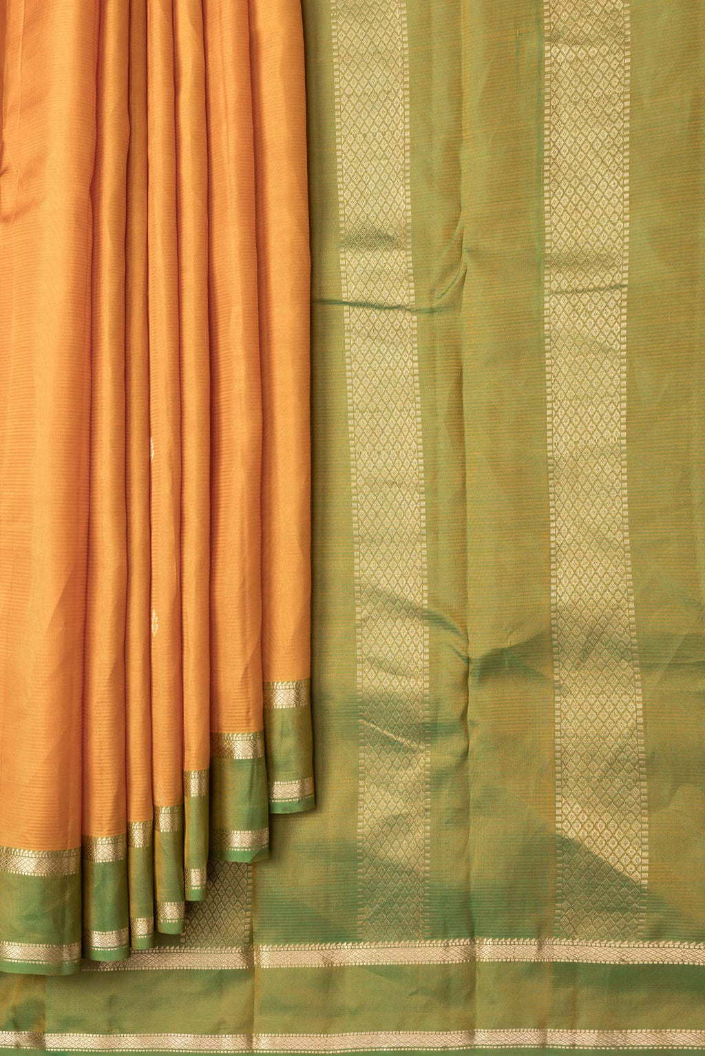 Pleats and pallu of Mustard Dual Tone Kanjivaram Silk Saree with Zari Butta on the body and Zari Border. 