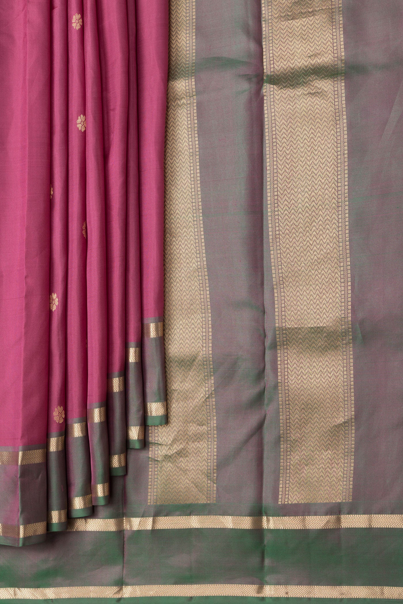 Pleats and pallu of Dark Pink Dual Tone Kanjivaram Silk Saree with Zari Butta on the body and Zari Border. 