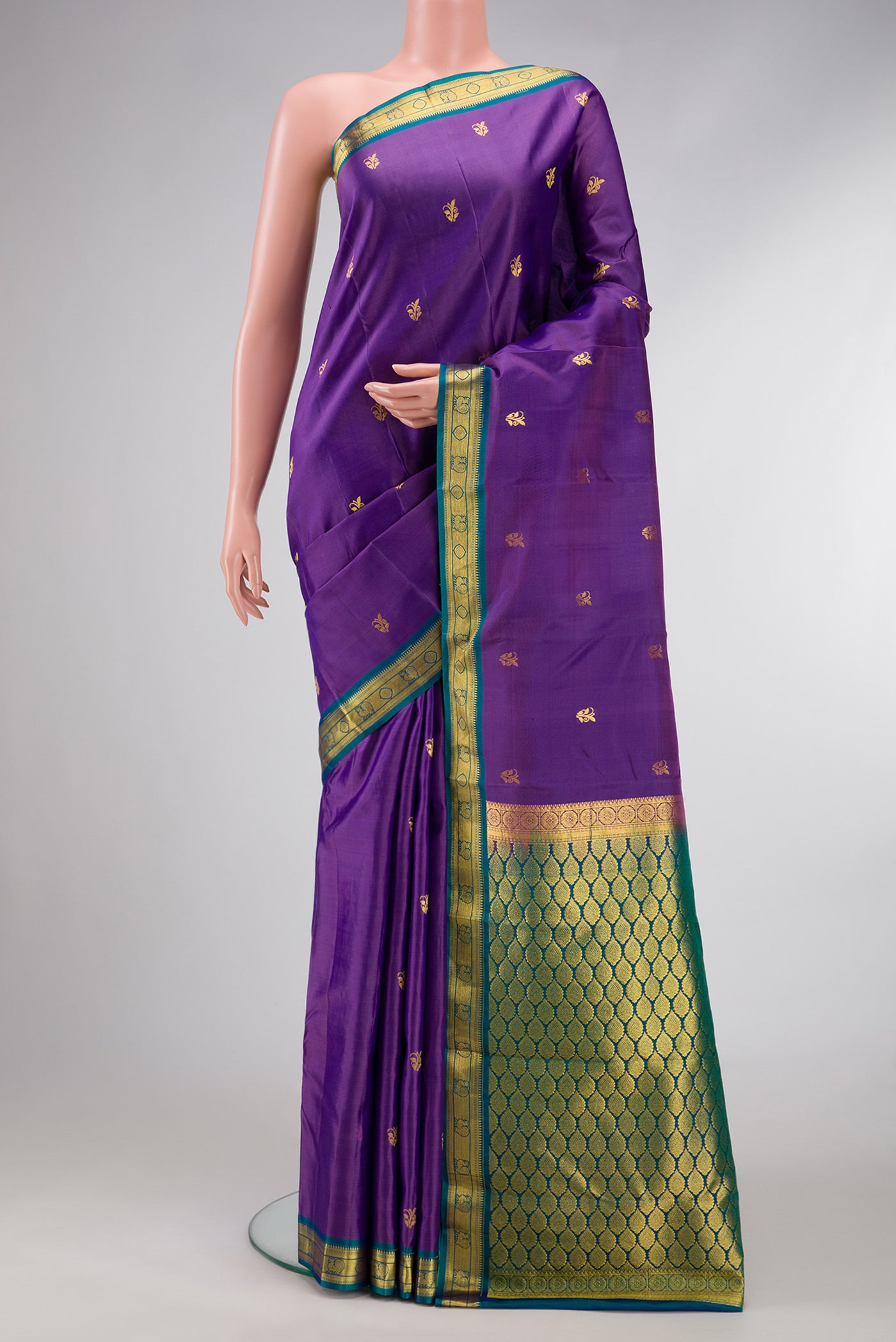 Purple Dual Tone Kanjivaram Silk Saree with Zari Butta on the body and Zari Border.  displayed on a mannequin