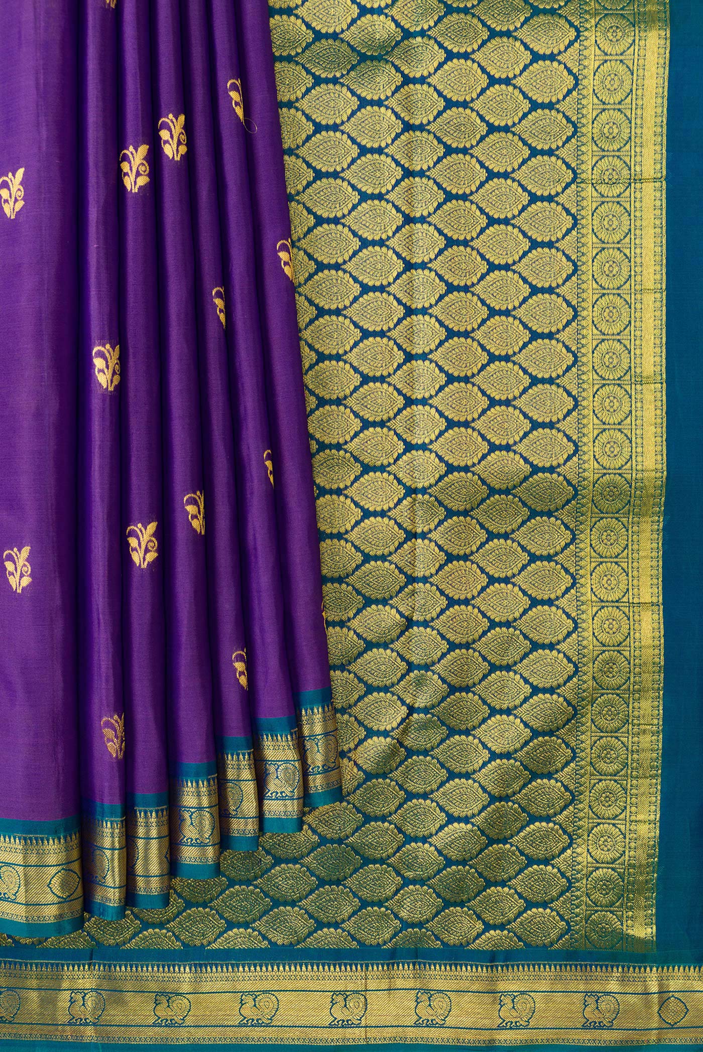 Pleats and pallu of Purple Dual Tone Kanjivaram Silk Saree with Zari Butta on the body and Zari Border. 