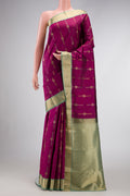 Magenta Dual Tone Kanchipuram Silk Saree with Zari Butta on the body and Zari Border.  displayed on a mannequin