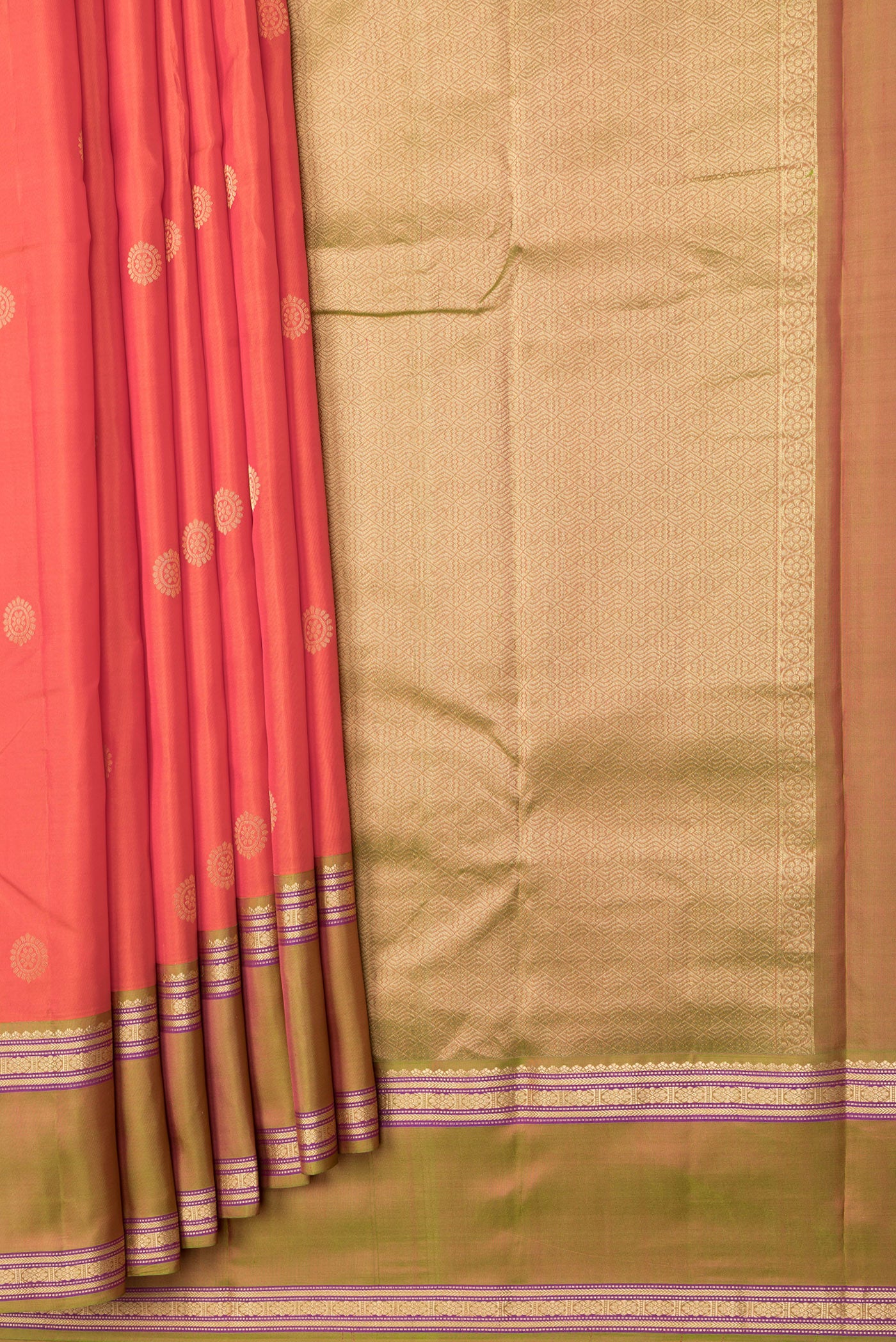 Pleats and pallu of Orange Dual Tone Kanchipuram Silk Saree with Zari Butta on the body and Zari Border. 