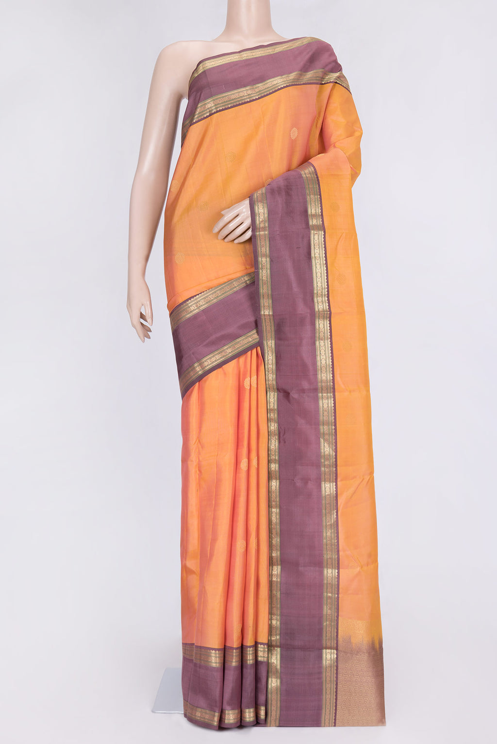 Sandal Dual Tone Kanchipuram Silk Saree with Zari Butta on the body and Zari Border.  displayed on a mannequin