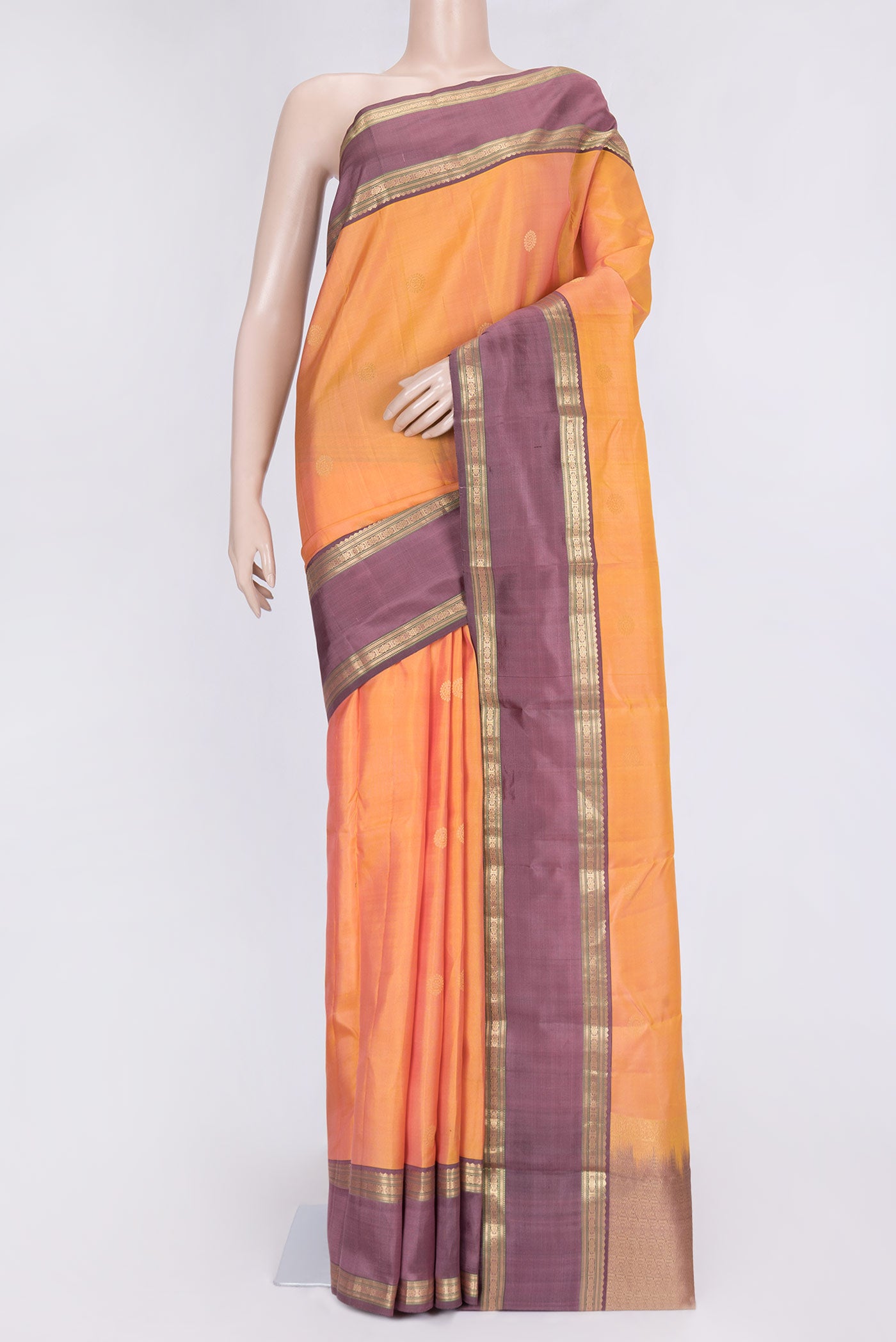 Sandal Dual Tone Kanchipuram Silk Saree with Zari Butta on the body and Zari Border.  displayed on a mannequin