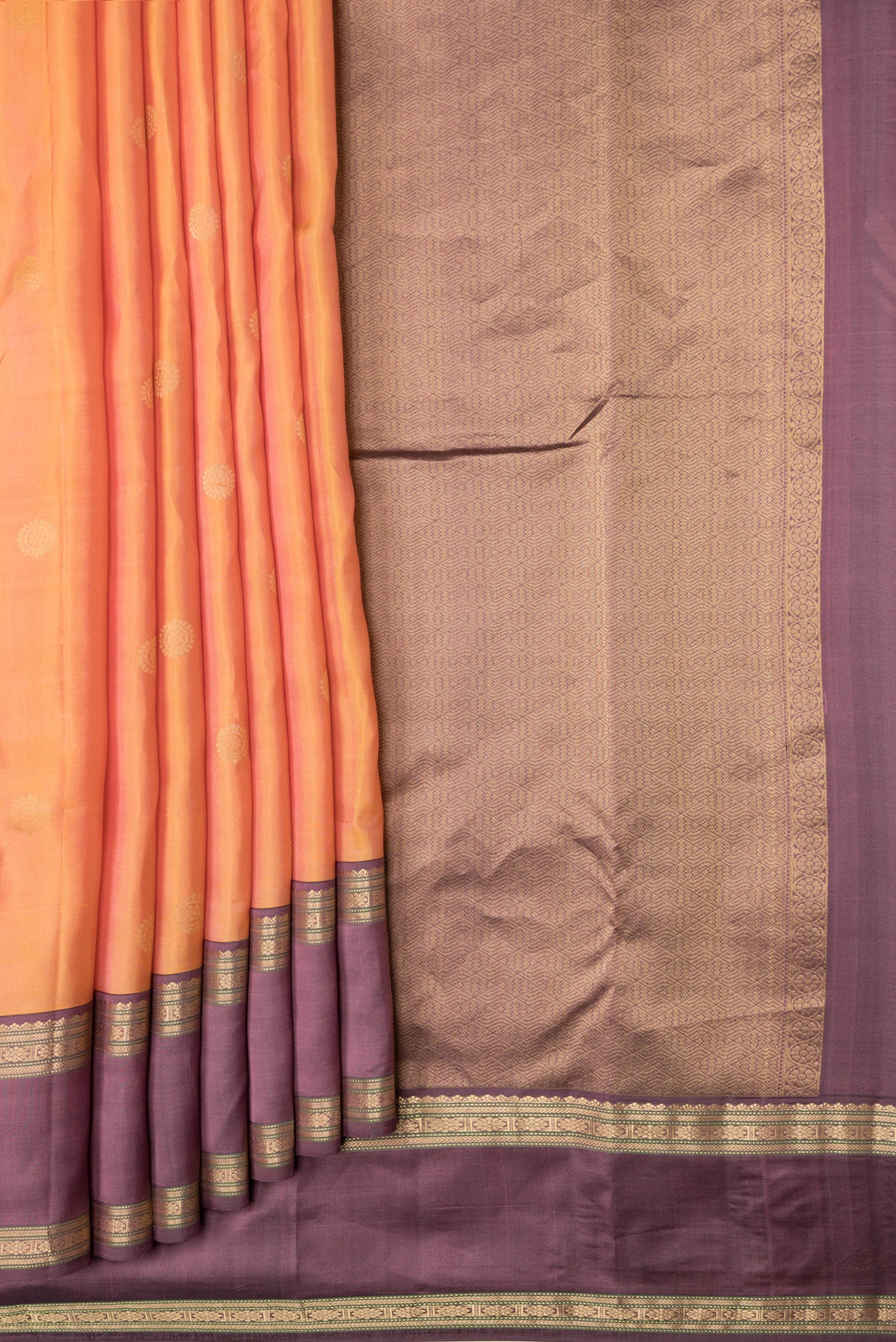 Pleats and pallu of Sandal Dual Tone Kanchipuram Silk Saree with Zari Butta on the body and Zari Border. 