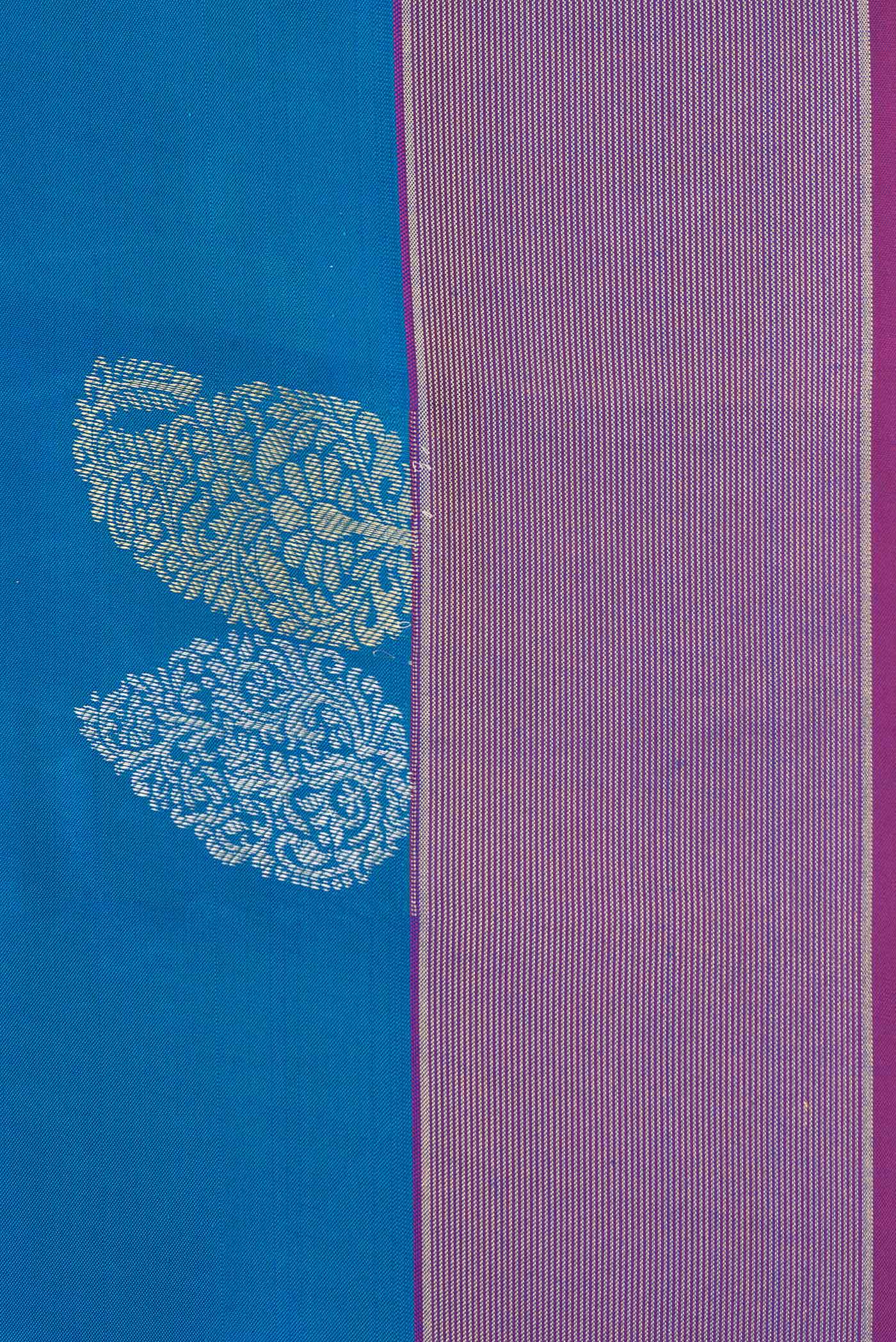Border image of Peacock Blue Dual Tone Kanchipuram Silk Saree with Zari Butta on the body and Zari Border. 
