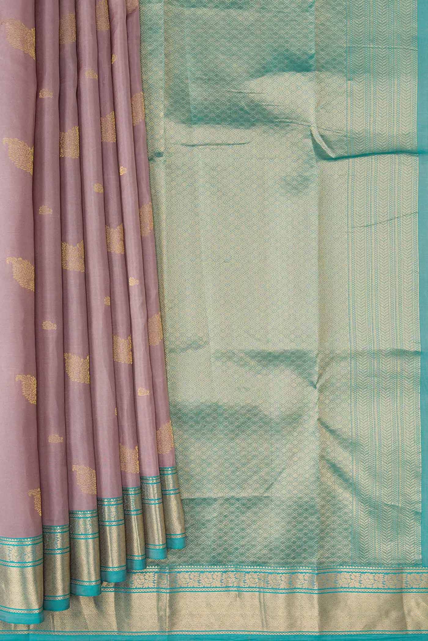 Pleats and pallu of Rose Gold Dual Tone Kanchipuram Silk Saree with Zari Butta on the body and Zari Border. 