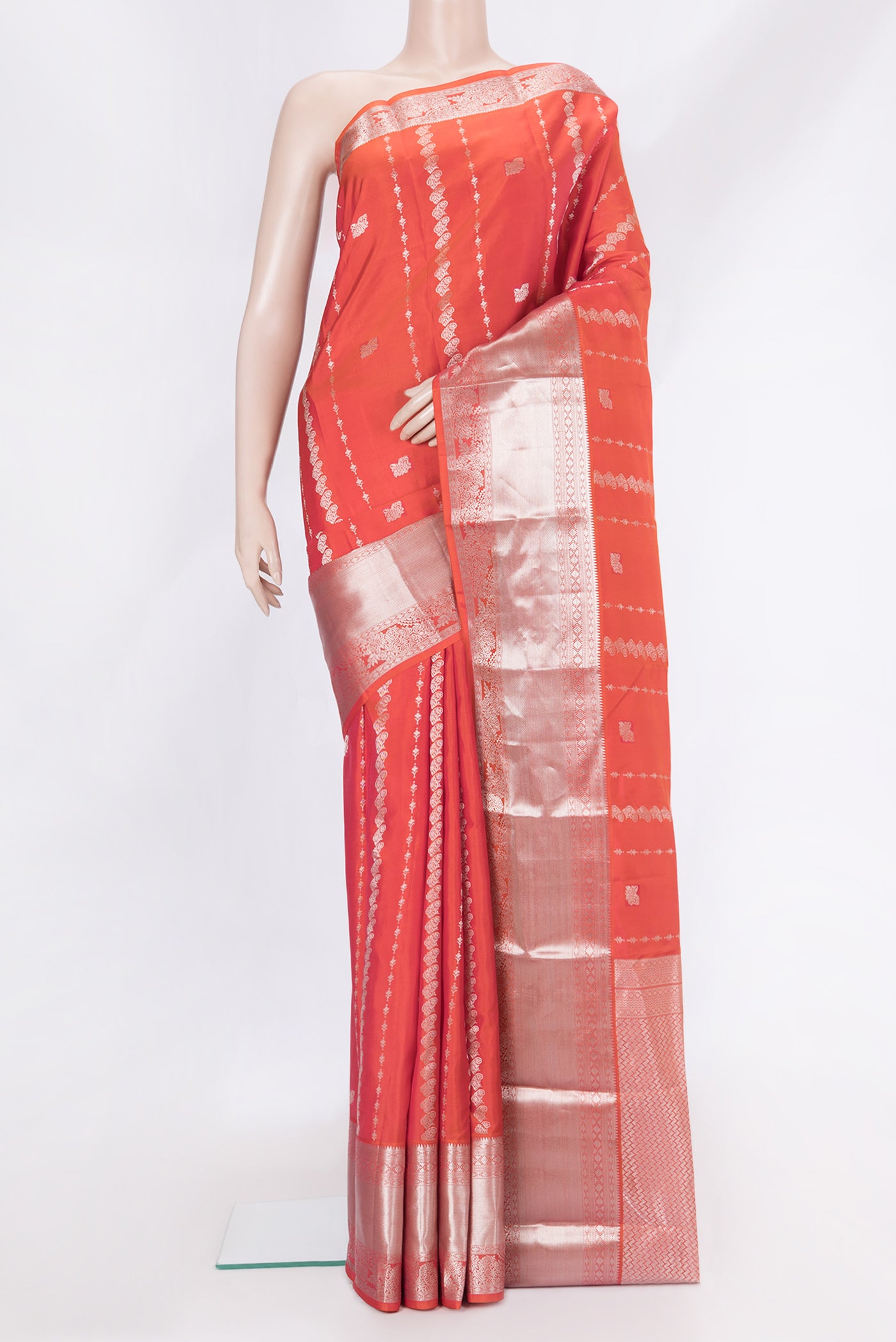 Coral Dual Tone Kanchipuram Silk Saree with Zari Butta on the body and Zari Border.  displayed on a mannequin