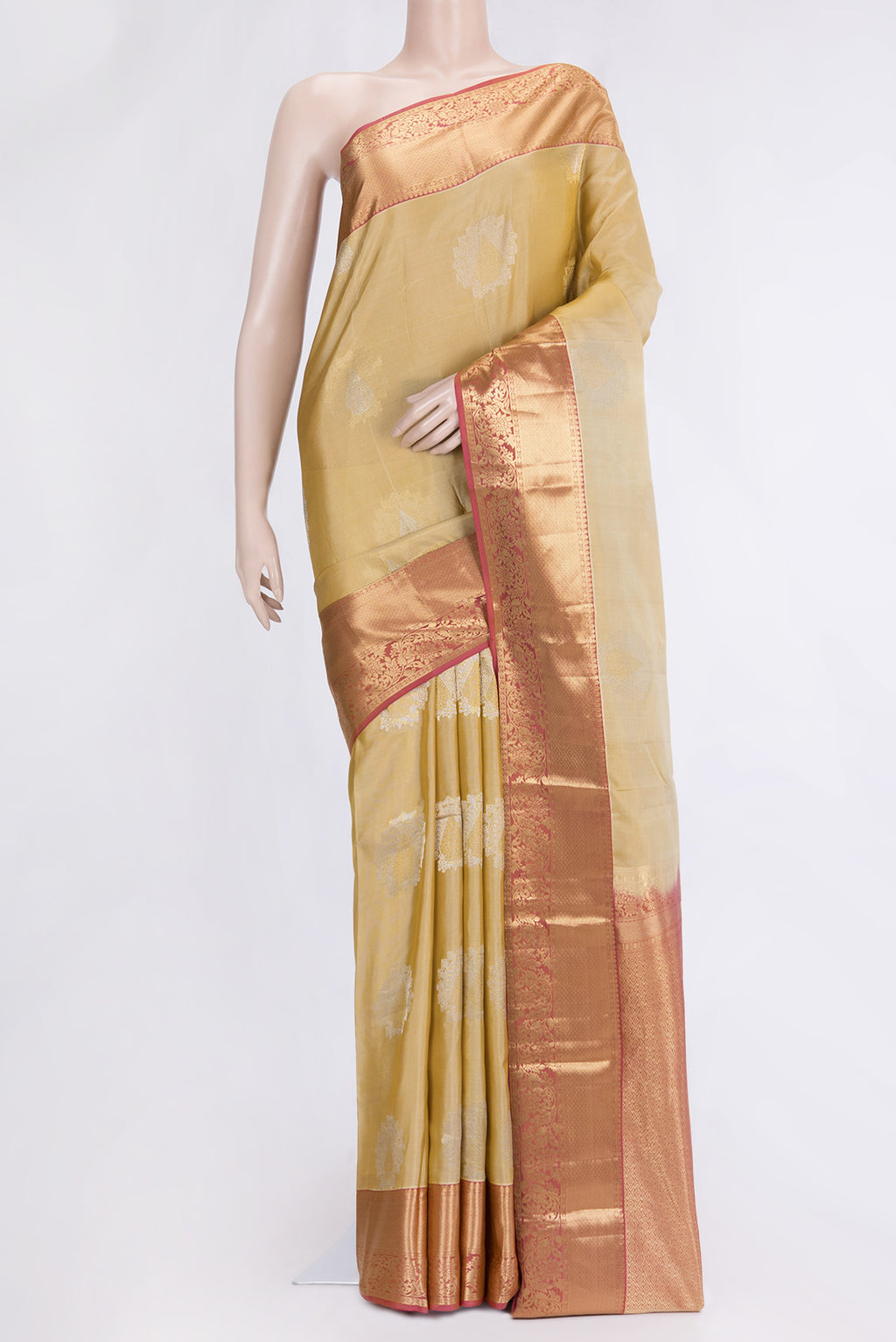 Beige Dual Tone Kanjivaram Silk Saree with Zari Butta on the body and Zari Border.  displayed on a mannequin