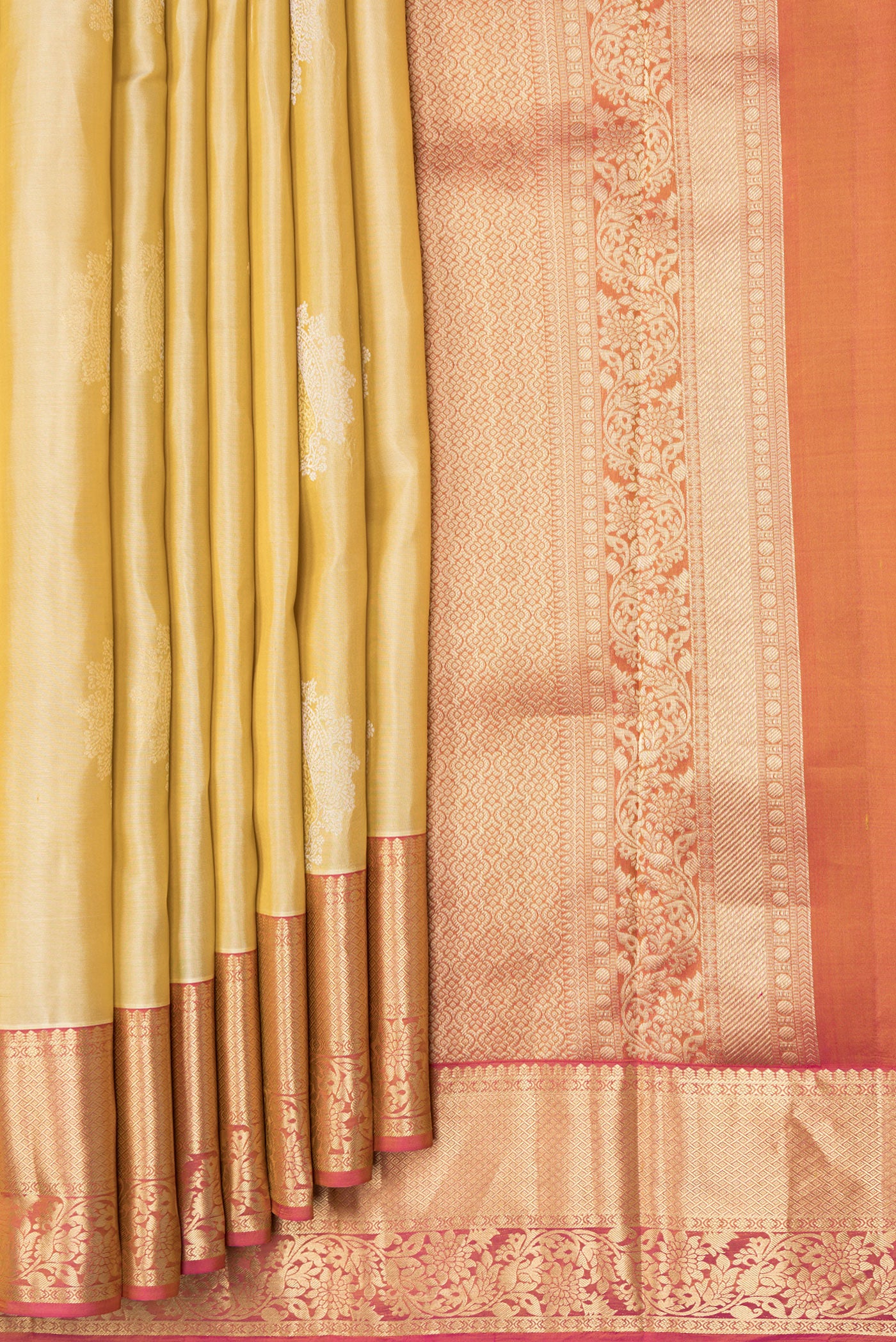 Pleats and pallu of Beige Dual Tone Kanjivaram Silk Saree with Zari Butta on the body and Zari Border. 
