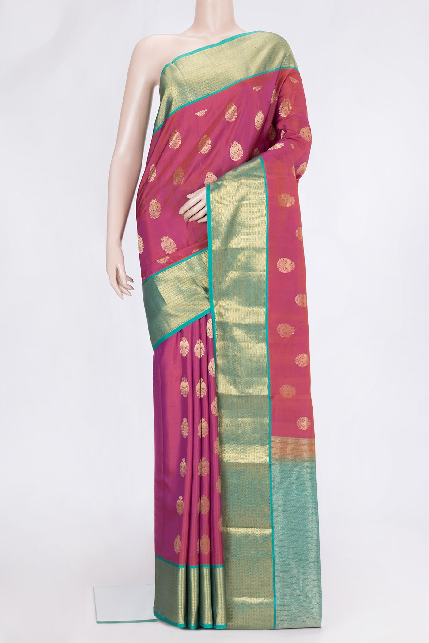 Pink Dual Tone Kanchipuram Silk Saree with Zari Butta on the body and Zari Border.  displayed on a mannequin