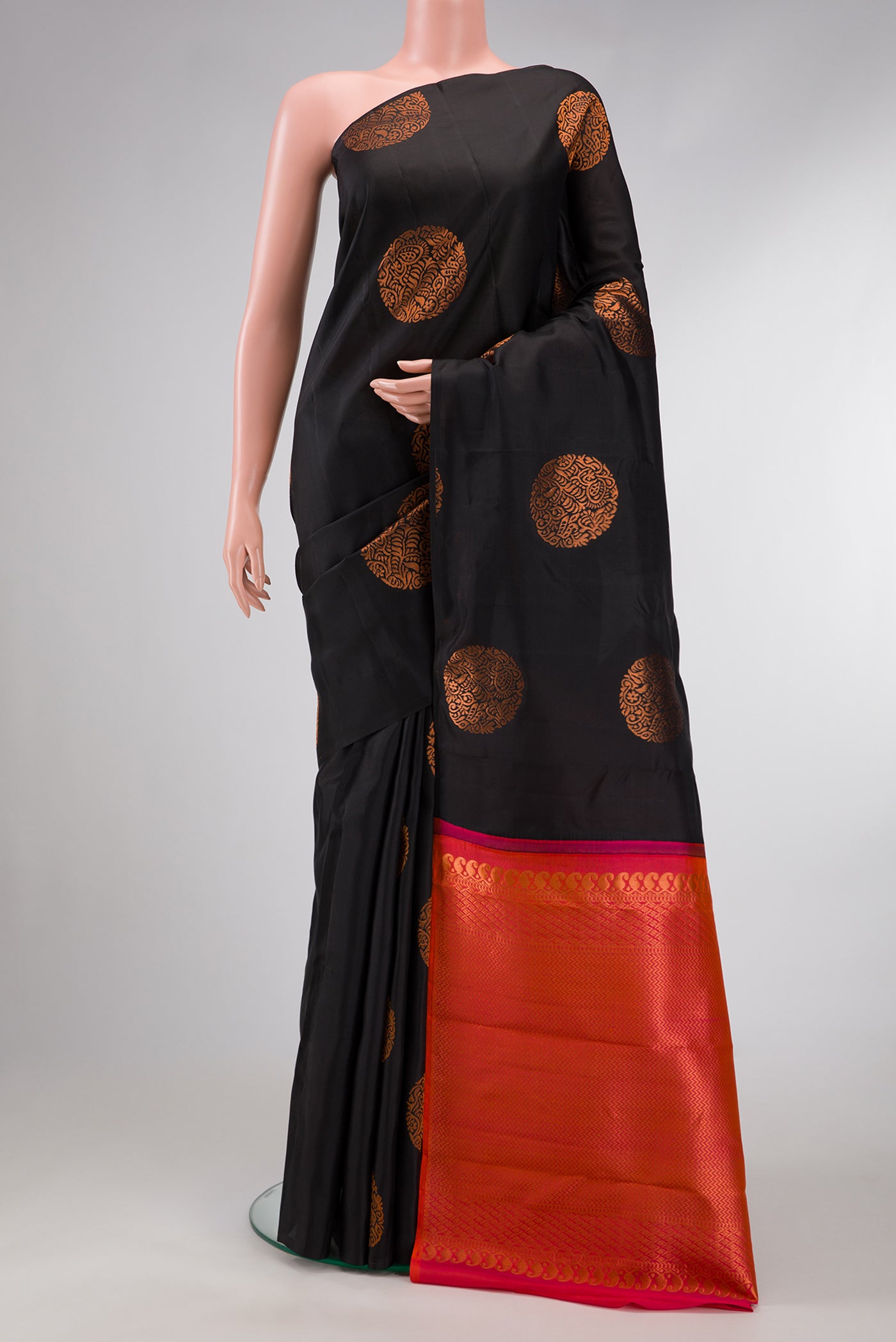 Black Dual Tone Kanjivaram Silk Saree with Zari Butta on the body and Without Border.  displayed on a mannequin