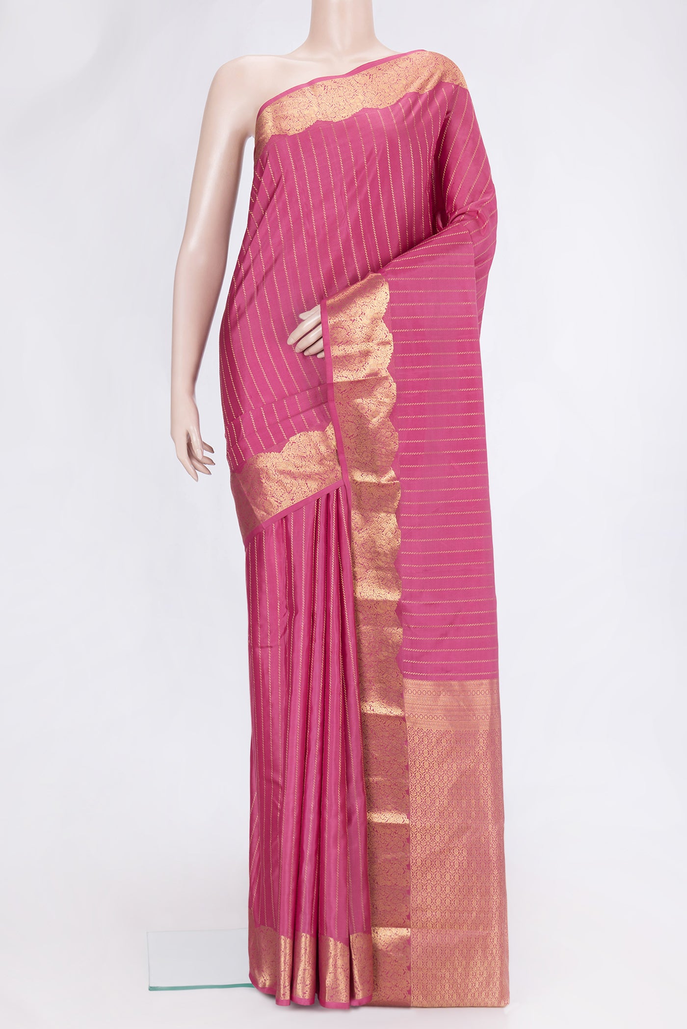 Pink Dual Tone Kanchipuram Silk Saree with Stripes on the body and Fancy Border.  displayed on a mannequin