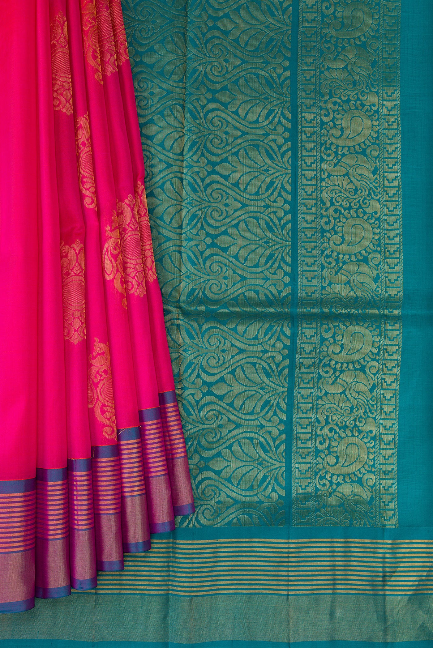 Pleats and pallu of Pink Soft Silk Saree with Zari Butta on the body and Zari Border. 