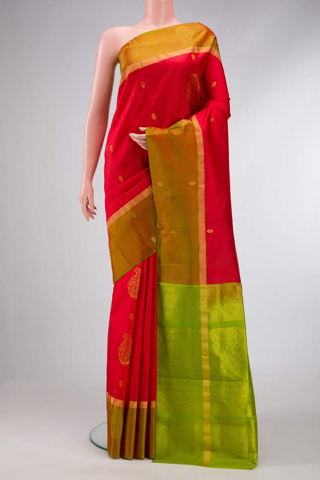 Red Dual Tone Soft Silk Saree with Zari Butta on the body and Fancy Border.  displayed on a mannequin