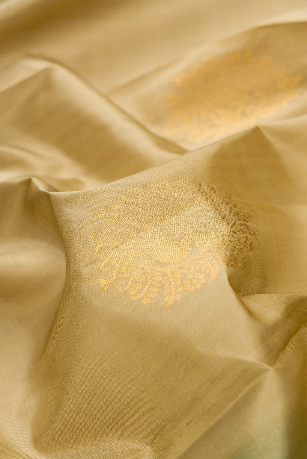 Close up of Mehandi Green Dual Tone Soft Silk Saree with Zari Butta on the body and Zari Border.  displaying folds