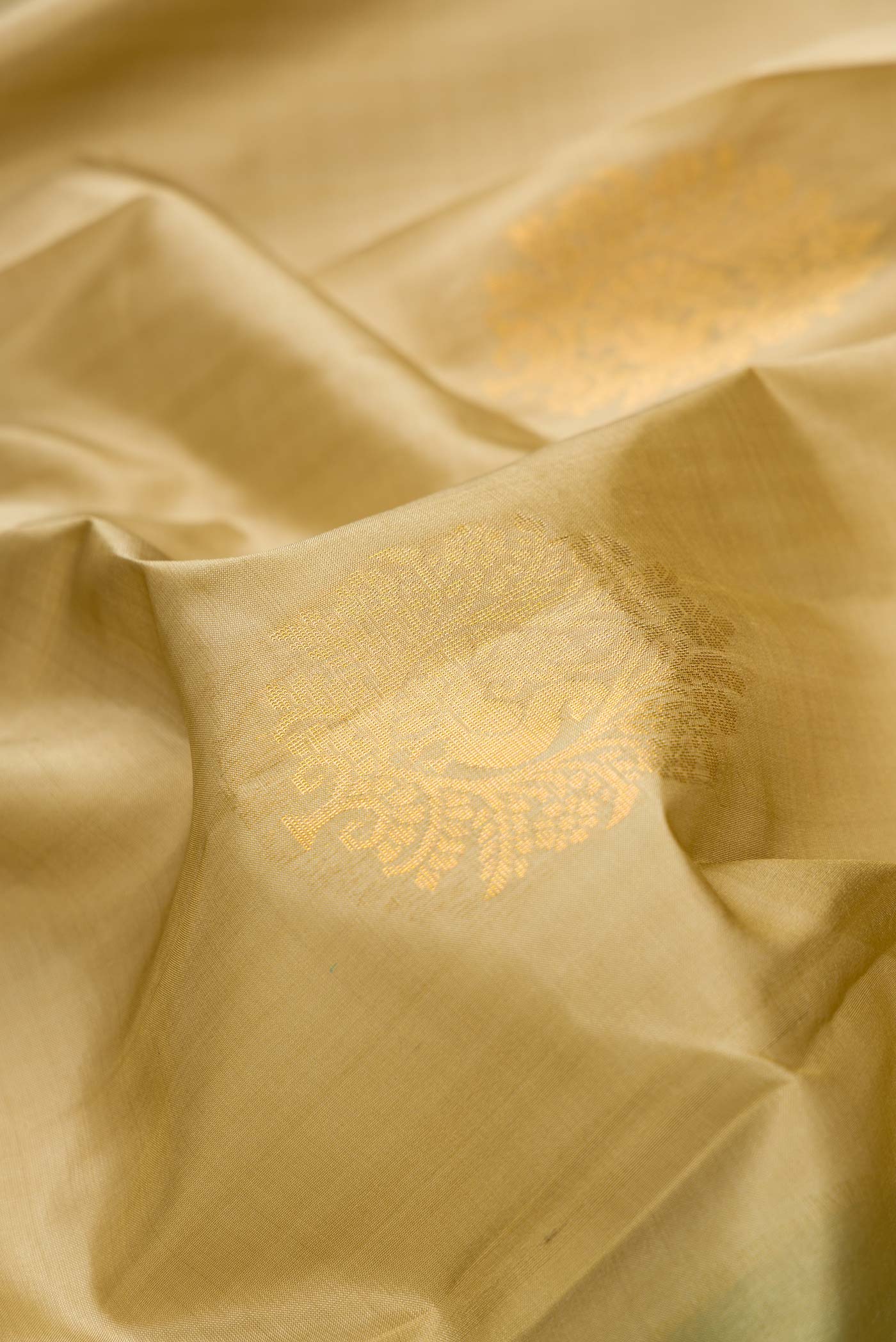 Close up of Mehandi Green Dual Tone Soft Silk Saree with Zari Butta on the body and Zari Border.  displaying folds