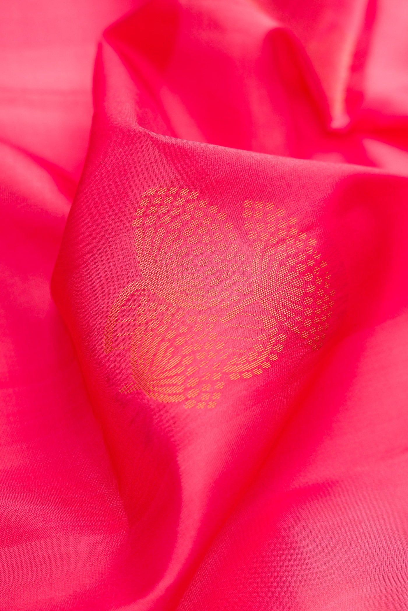 Close up of Pink Dual Tone Soft Silk Saree with Zari Butta on the body and Zari Border.  displaying folds