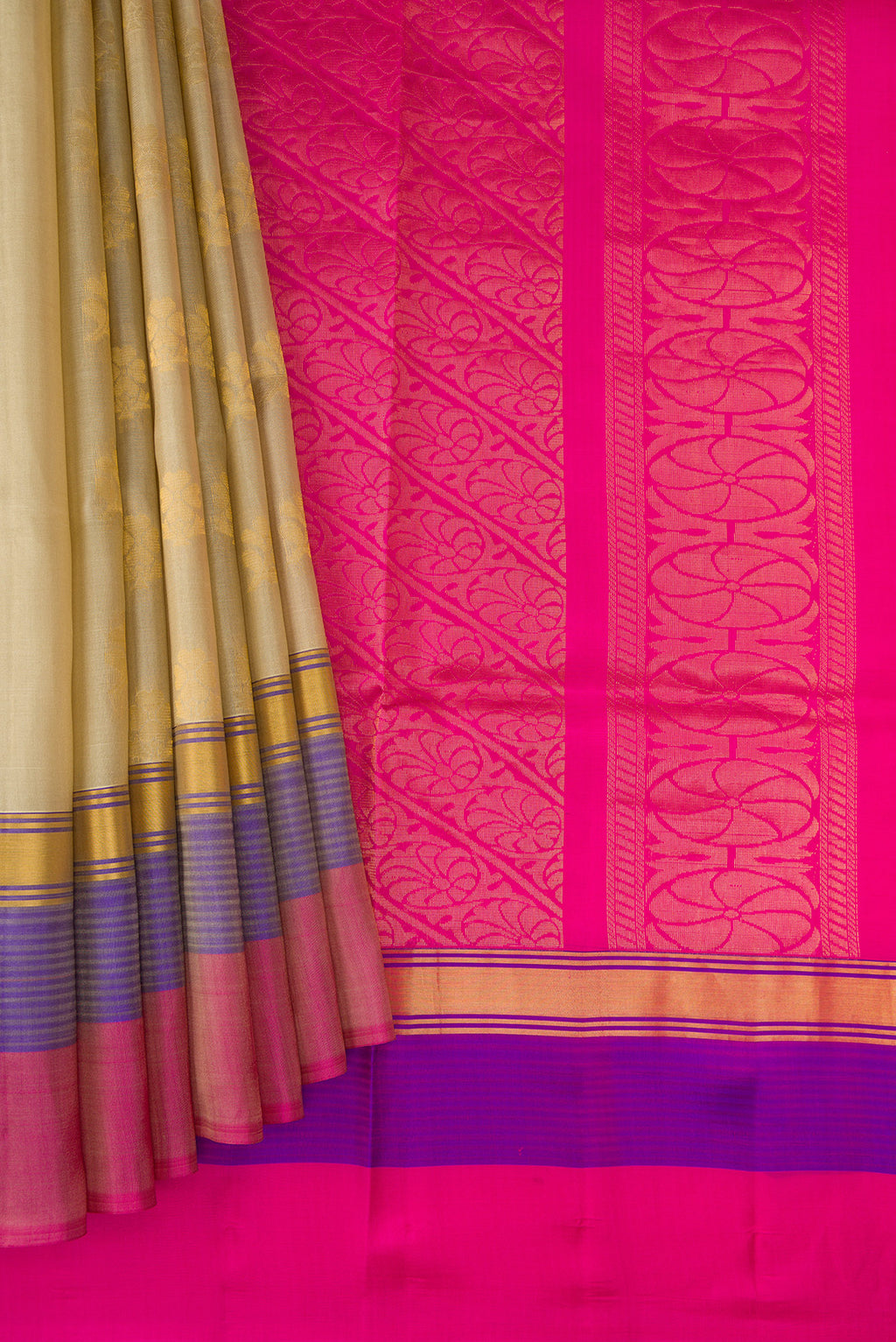 Pleats and pallu of Beige Soft Silk Saree with Zari Butta on the body and Zari Border. 