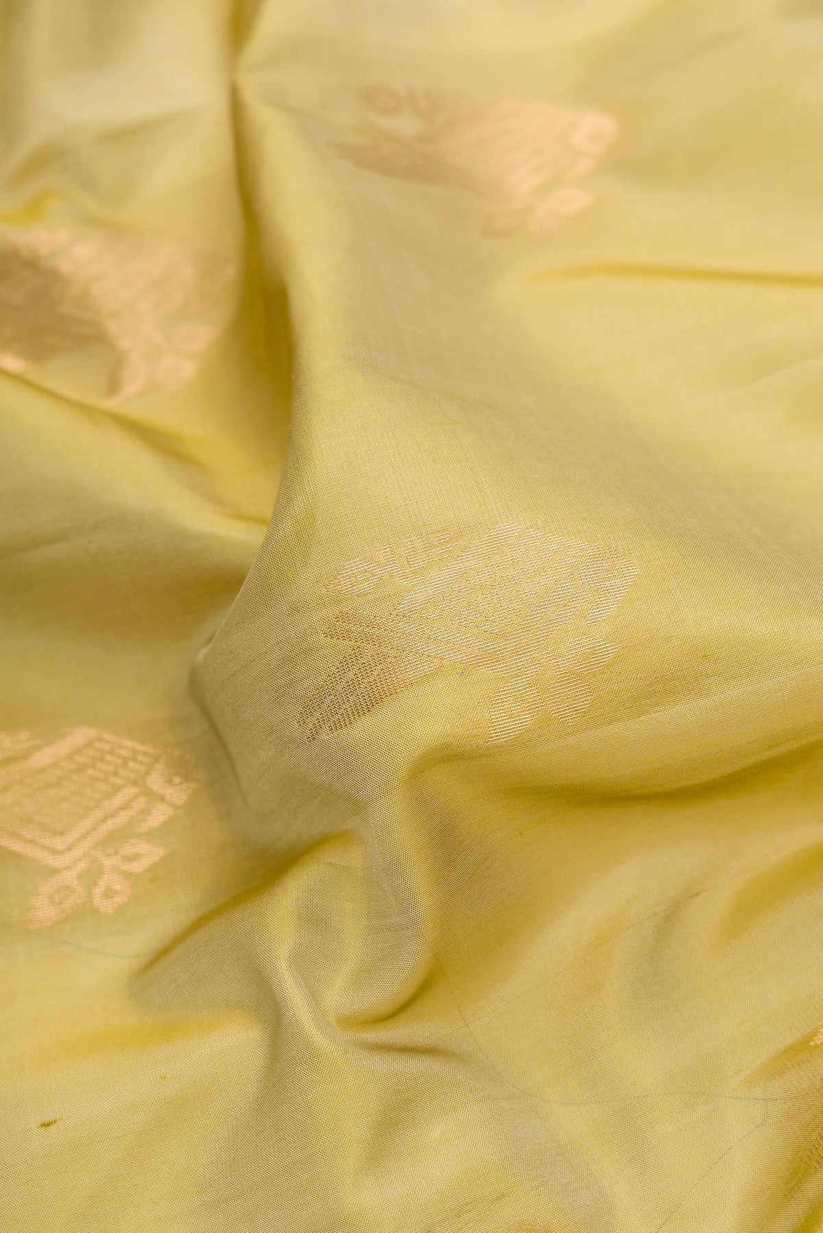 Close up of Mehandi Green Dual Tone Soft Silk Saree with Zari Butta on the body and Zari Border.  displaying folds