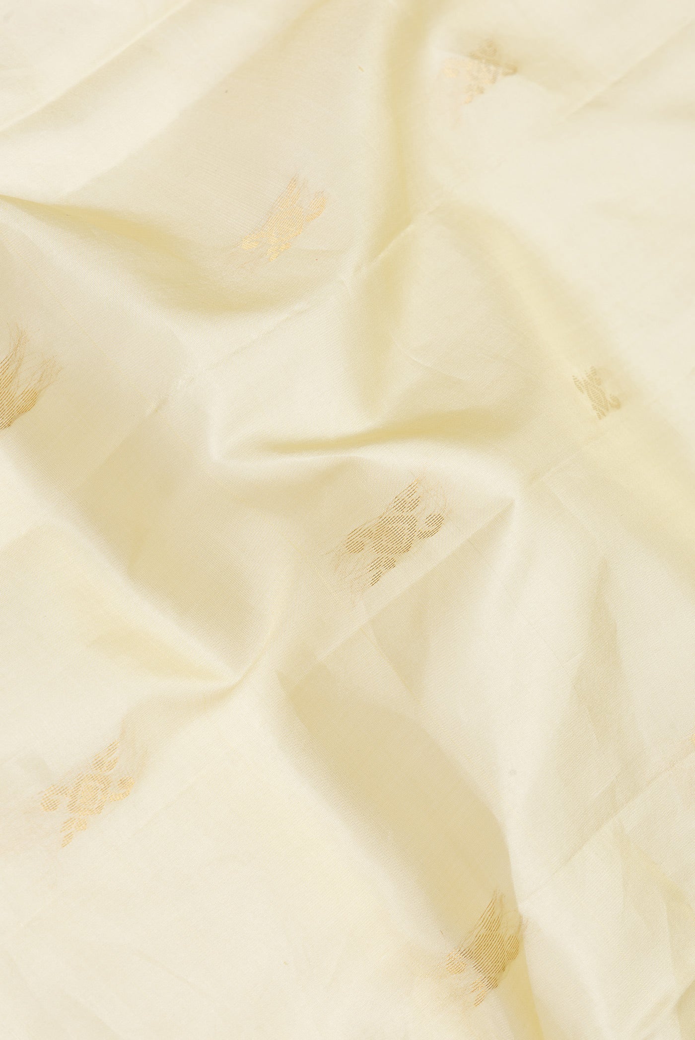 Close up of Pista Green Dual Tone Soft Silk Saree with Zari Butta on the body and Fancy Border.  displaying folds