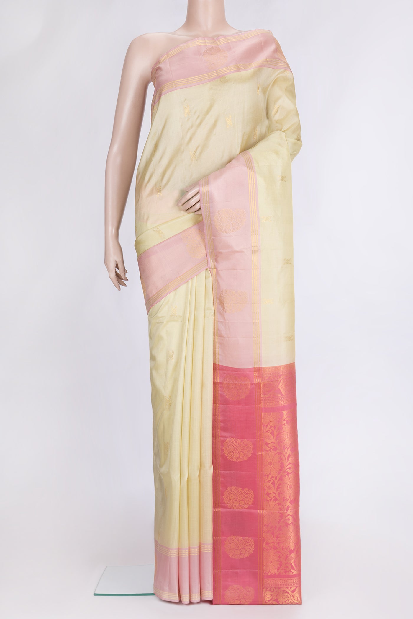 Pista Green Dual Tone Soft Silk Saree with Zari Butta on the body and Fancy Border.  displayed on a mannequin