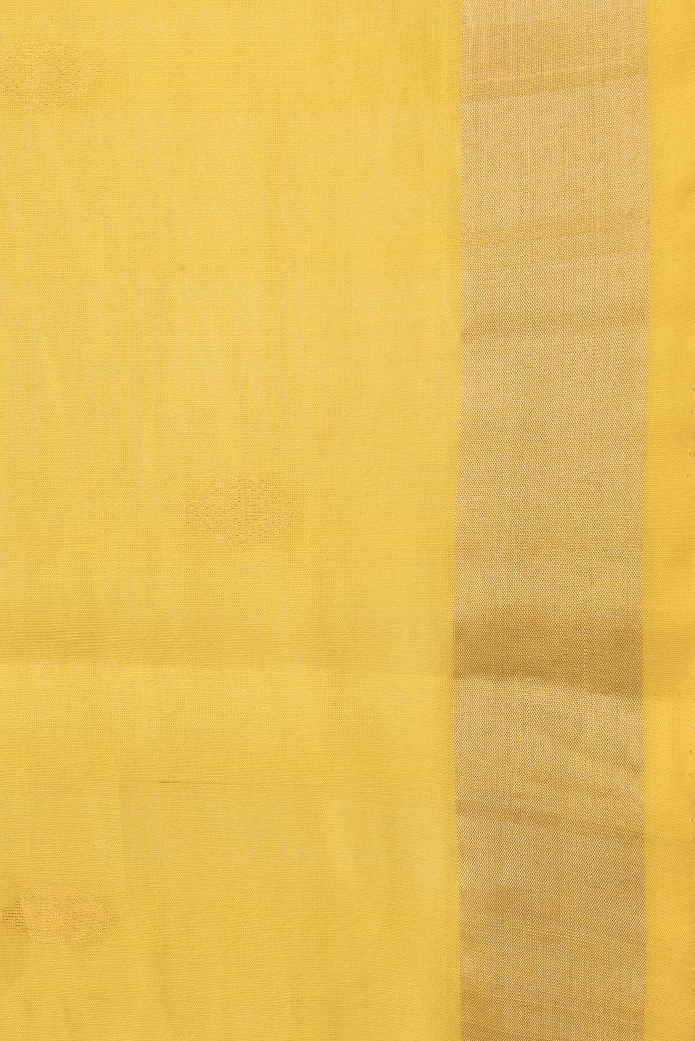 Border image of Yellow Dual Tone Silk Cotton Saree with Zari Butta on the body and Zari Border. 