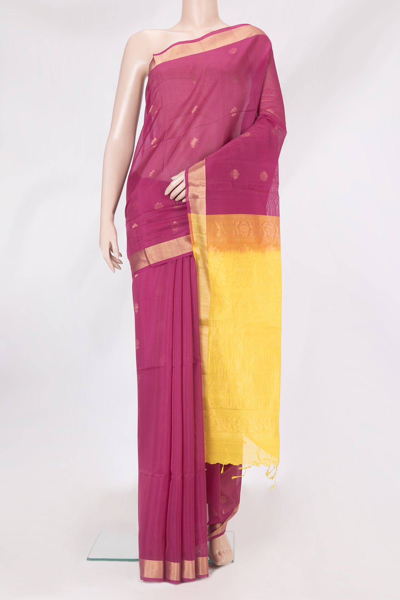 Magenta Silk Cotton Saree with Zari Butta on the body and Zari Border.  displayed on a mannequin