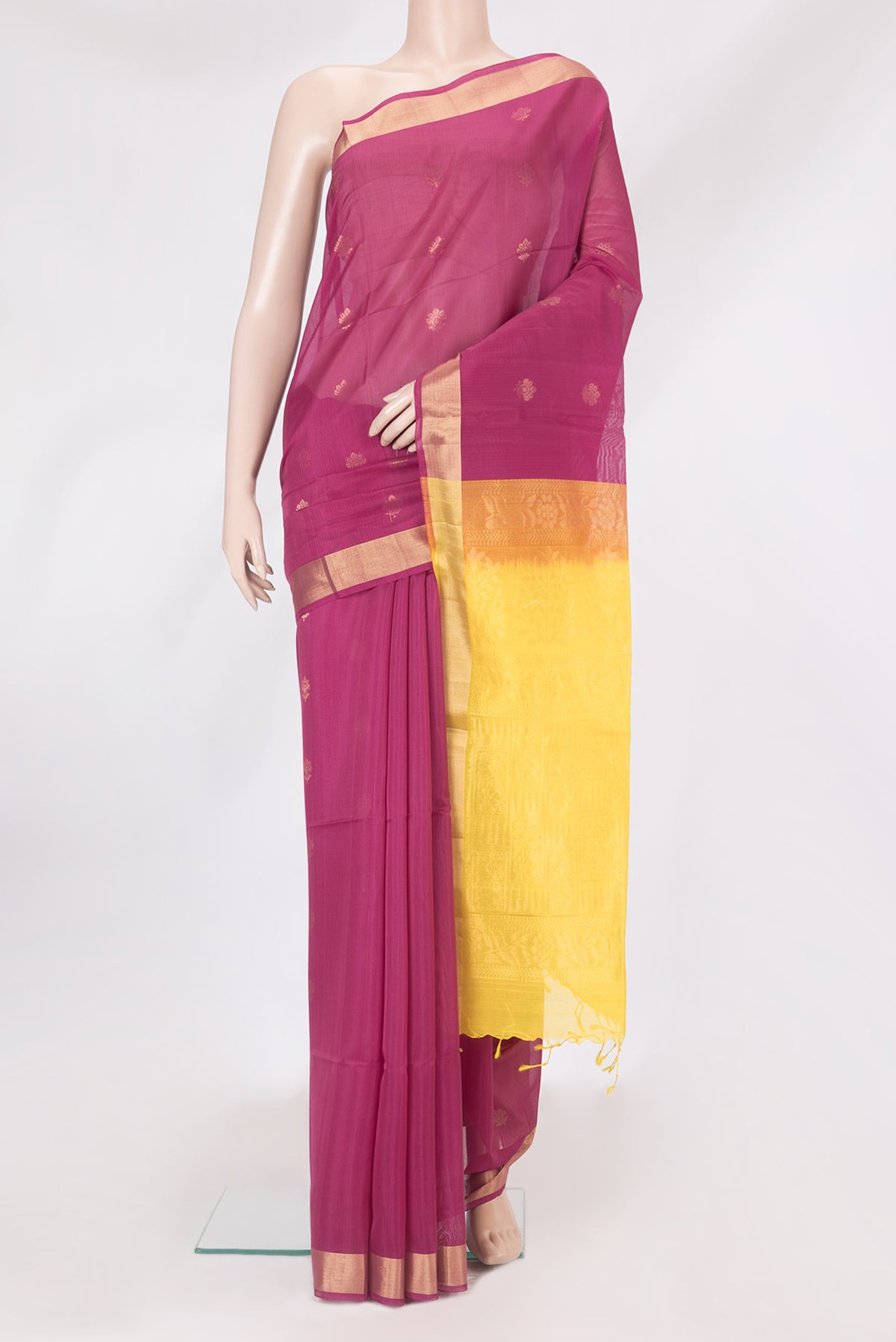 Magenta Silk Cotton Saree with Zari Butta on the body and Zari Border.  displayed on a mannequin