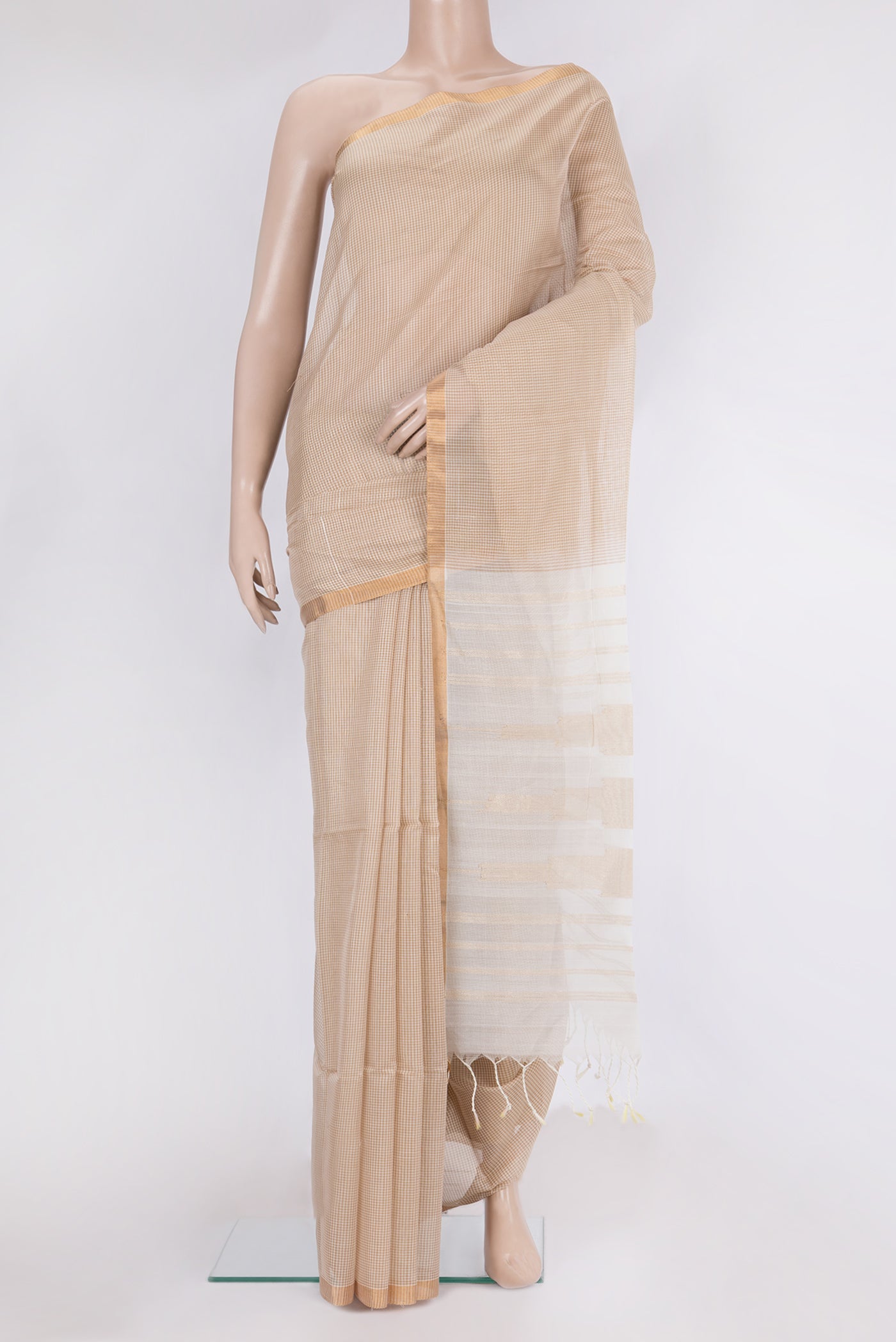 Beige Maheshwari Silk Saree with Checked design on the body and Zari Border.  displayed on a mannequin