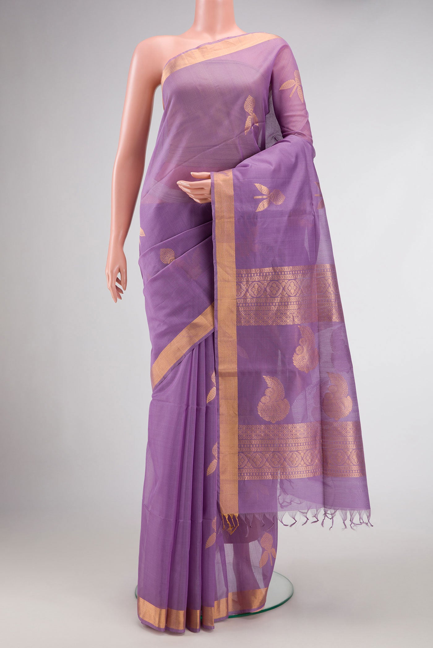 Lavender Dual Tone Silk Cotton Saree with Zari Butta on the body and Zari Border.  displayed on a mannequin