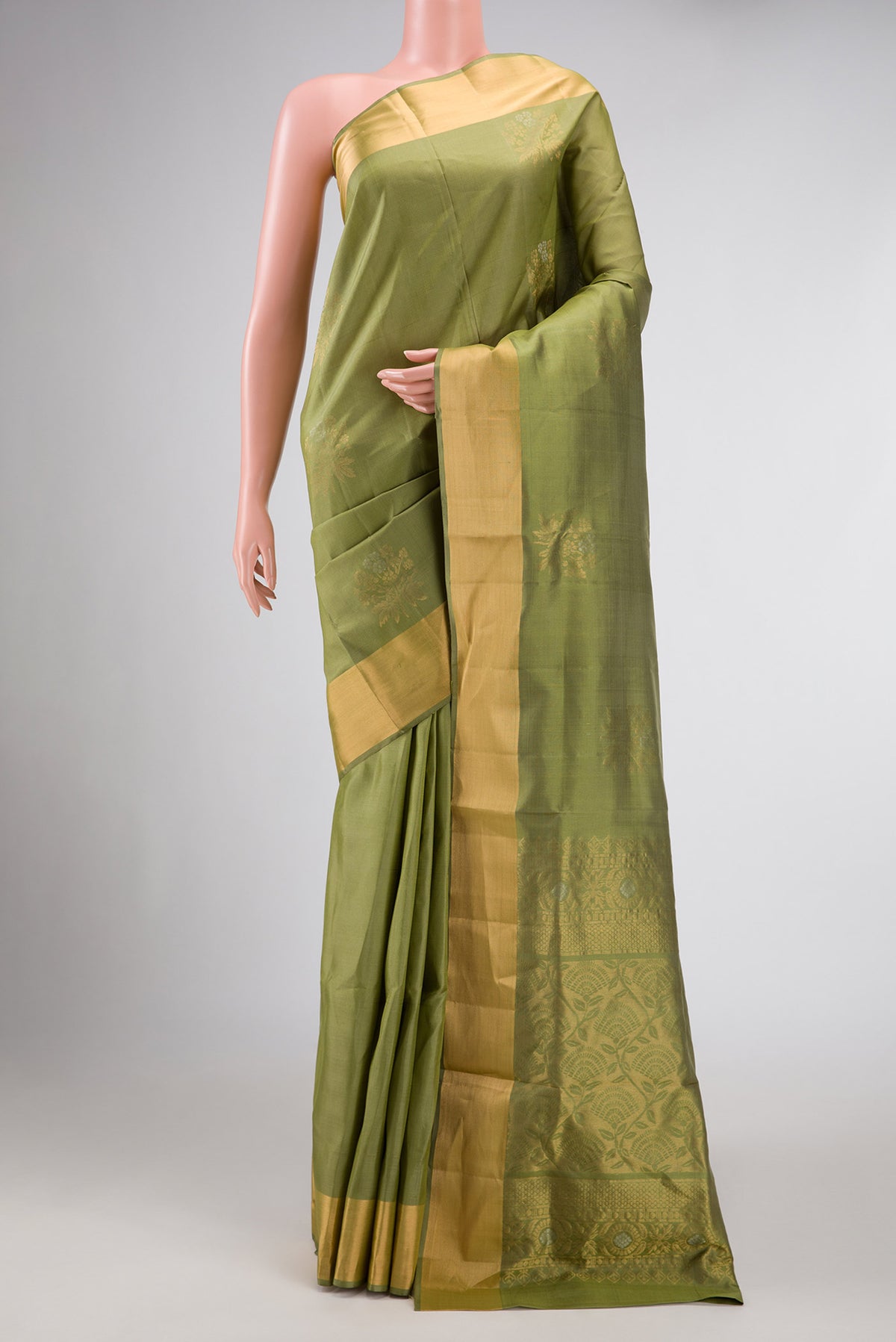 Mehandi Green Dual Tone Soft Silk Saree with Zari Butta on the body and Zari Border displayed on a mannequin