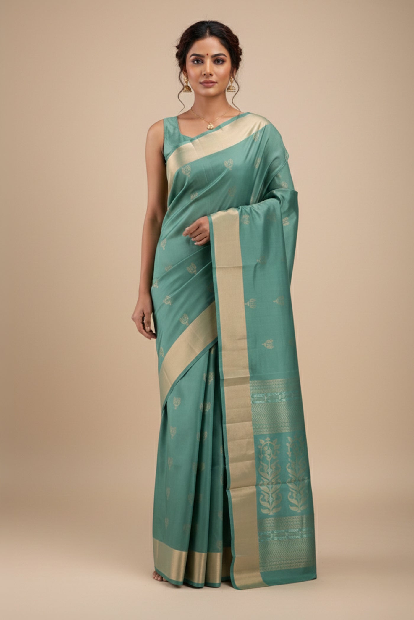 Model wearing a Green Dual Tone Soft Silk Saree with Zari Butta on the body and Zari Border
