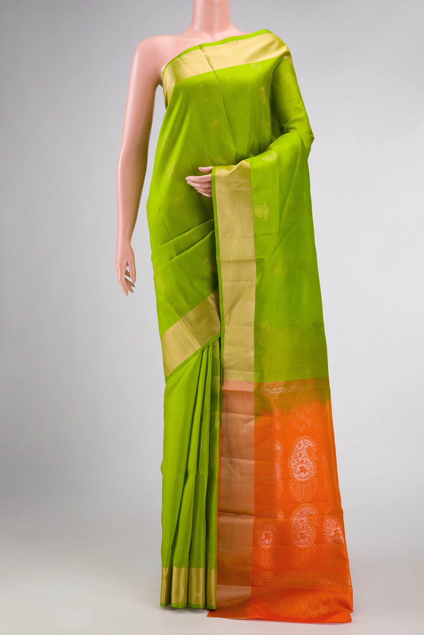 Parrot Green Dual Tone Soft Silk Saree with Zari Butta on the body and Zari Border displayed on a mannequin