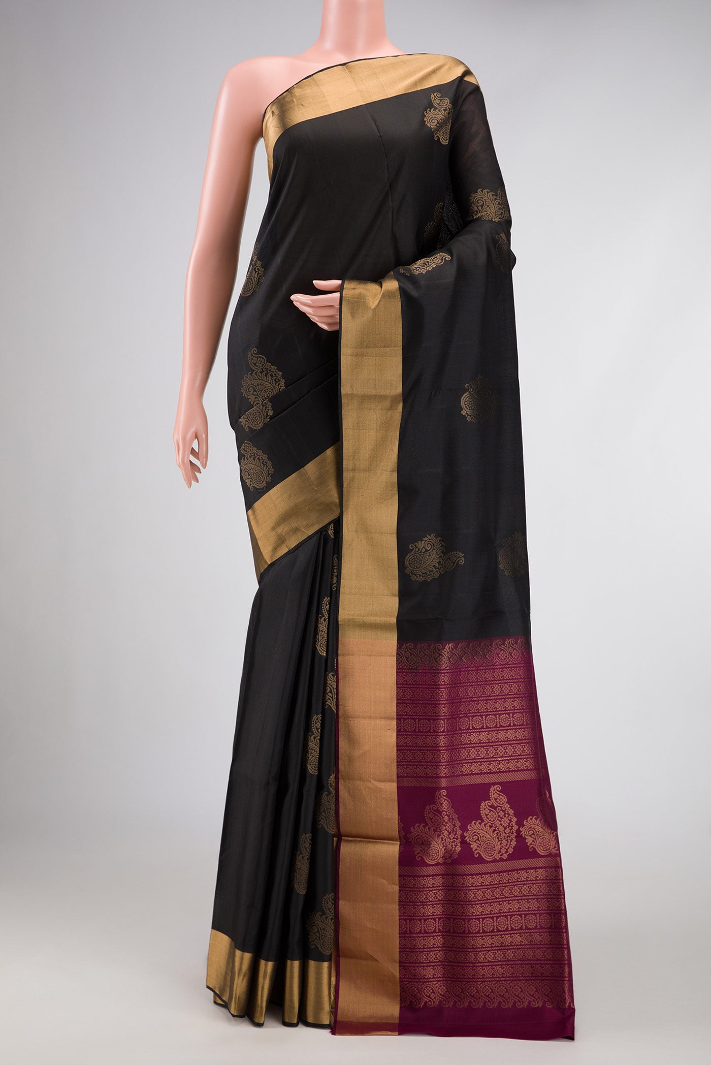 Black Dual Tone Soft Silk Saree with Zari Butta on the body and Zari Border.  displayed on a mannequin