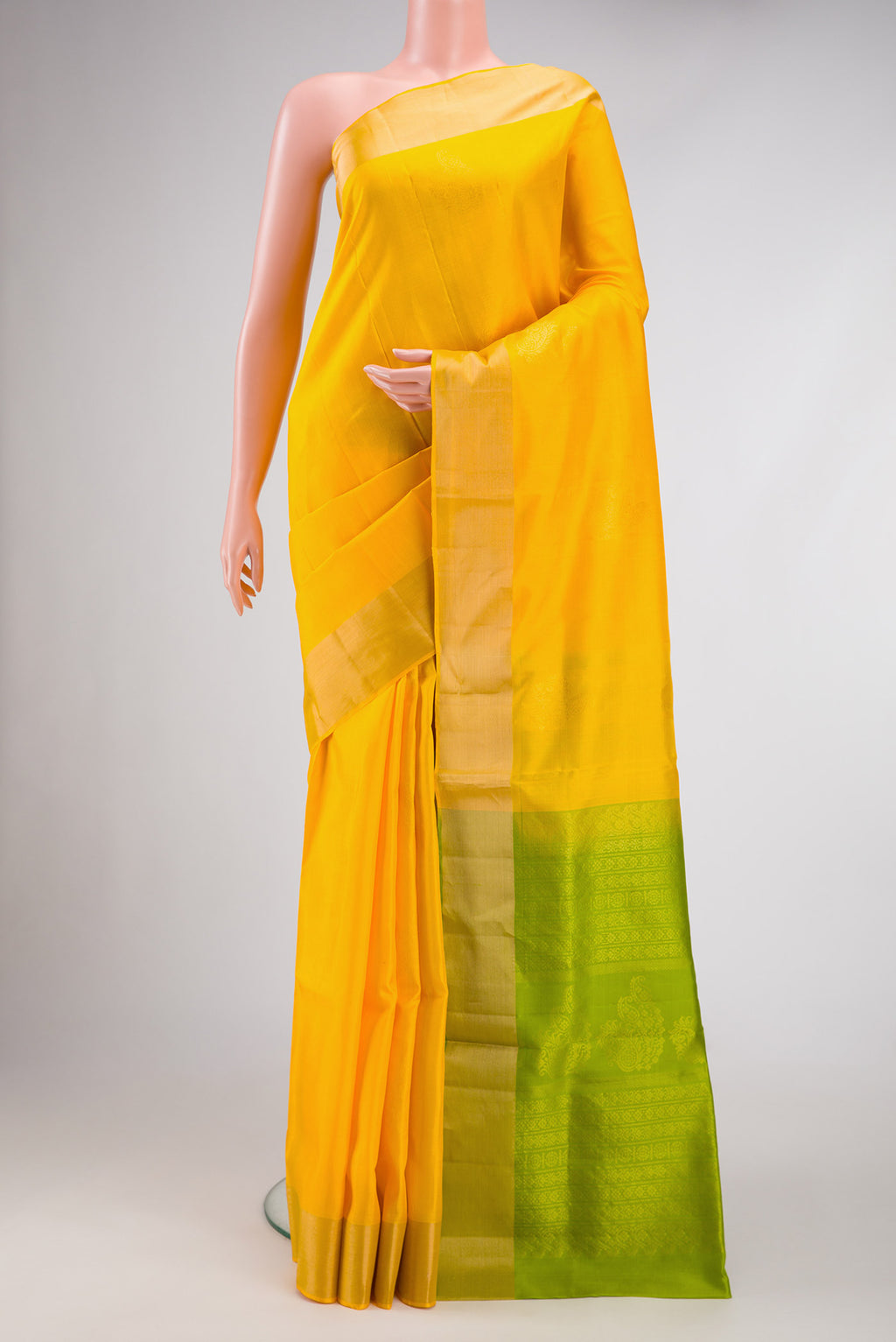 Yellow Dual Tone Soft Silk Saree with Zari Butta on the body and Zari Border.  displayed on a mannequin