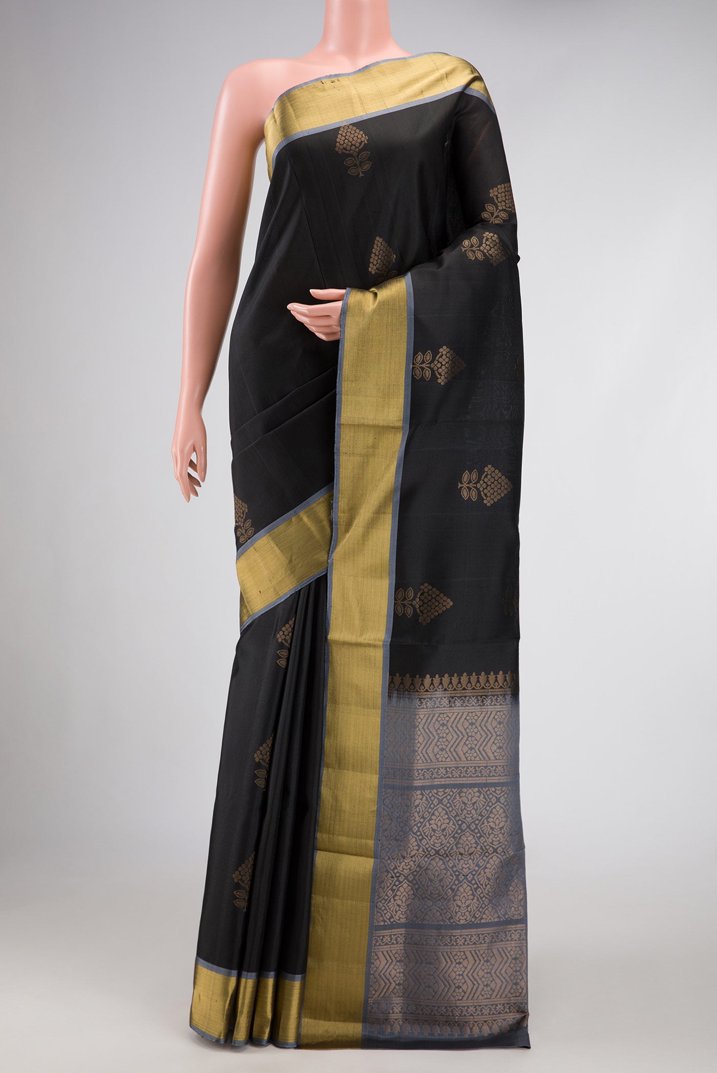 Black Dual Tone Soft Silk Saree with Zari Butta on the body and Zari Border.  displayed on a mannequin