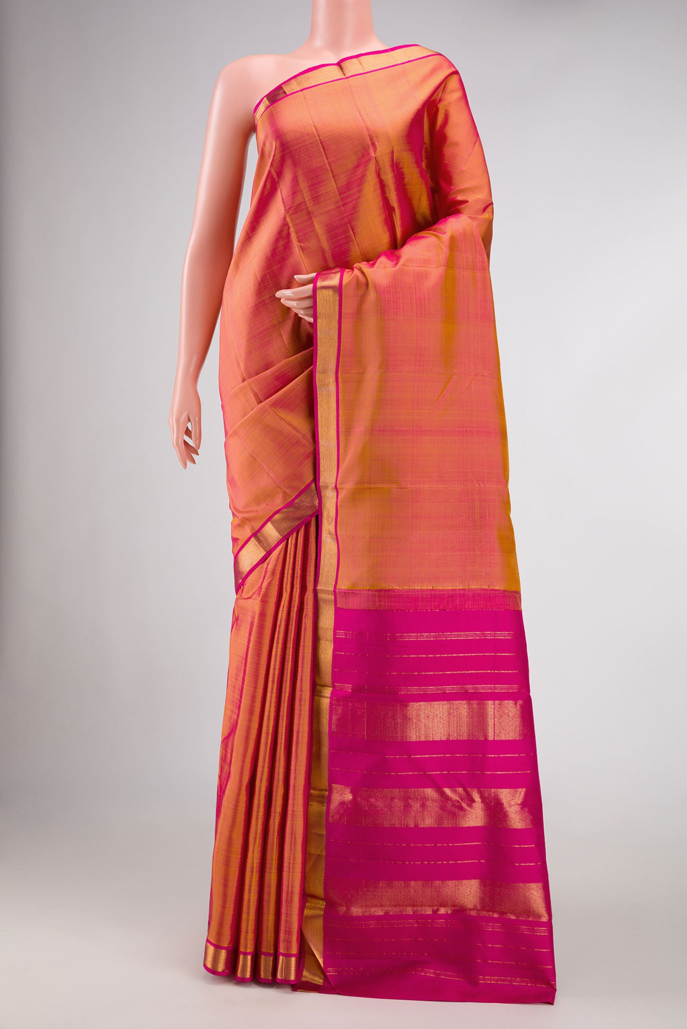 Mustard Dual Tone Kanjivaram Silk Saree with Plain Body and Zari Border.  displayed on a mannequin