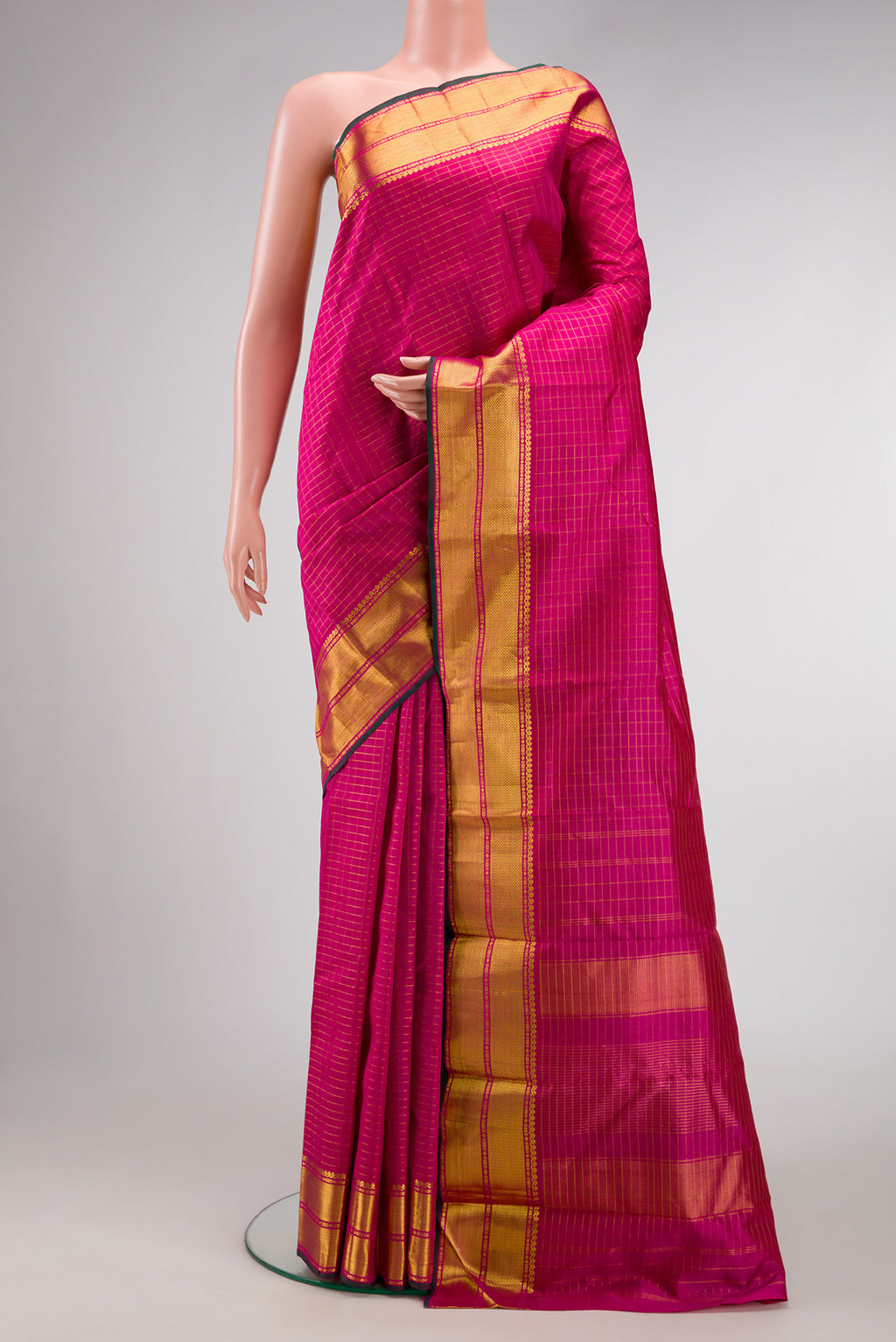 Pink Dual Tone Kanchipuram Silk Saree with Checked design on the body and Zari Border.  displayed on a mannequin