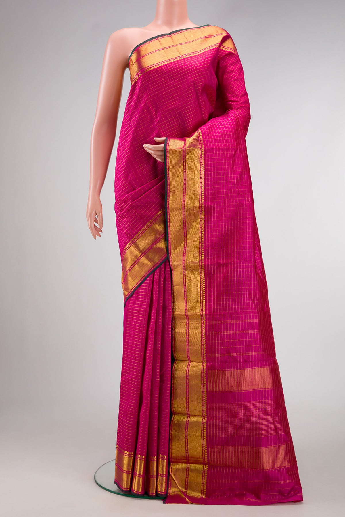 Pink Dual Tone Kanchipuram Silk Saree with Checked design on the body and Zari Border.  displayed on a mannequin