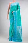 Sea Green Dual Tone Kanchipuram Silk Saree with Stripes on the body and Zari Border.  displayed on a mannequin