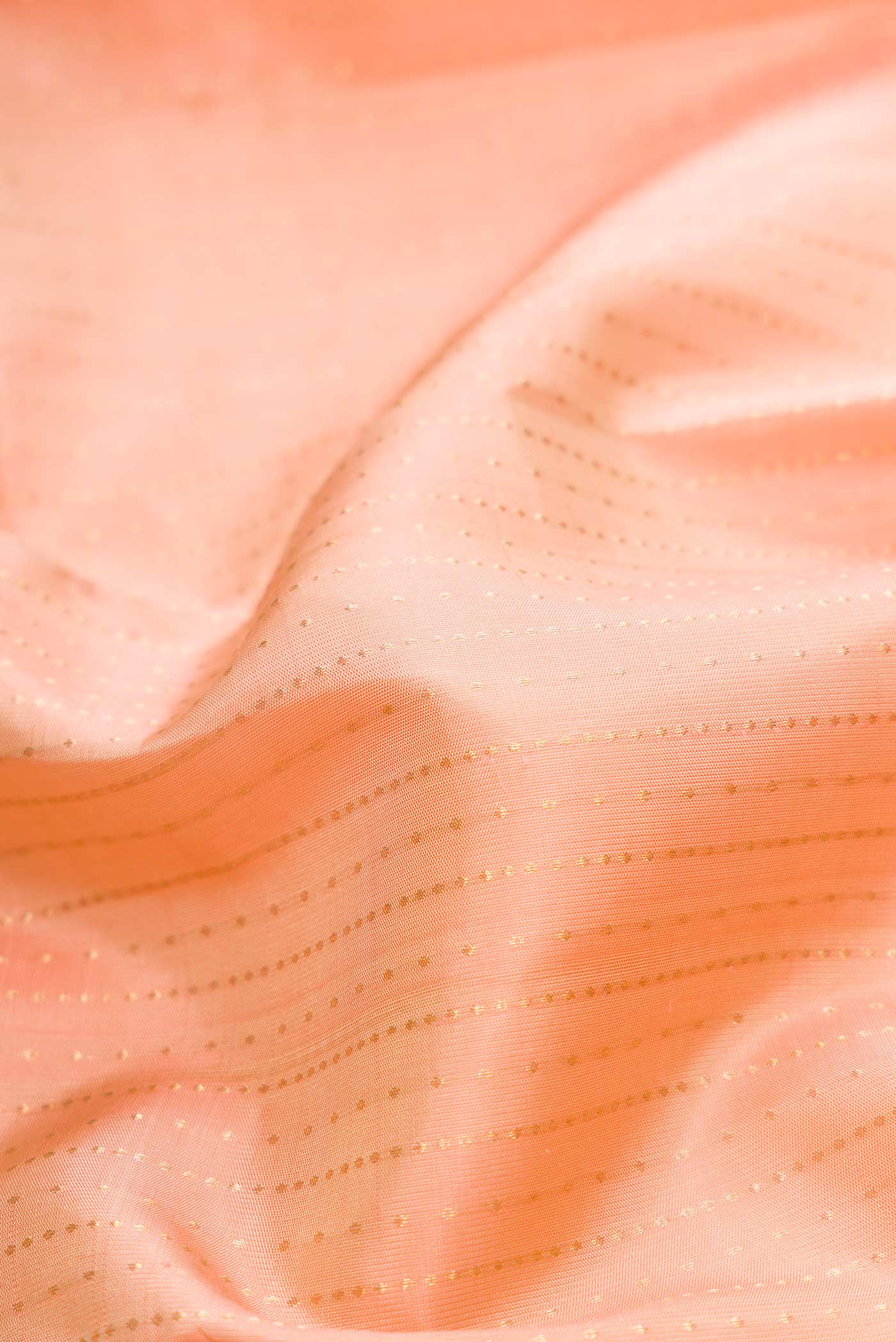 Close up of Sandal Dual Tone Kanchipuram Silk Saree with Checked design on the body and Plain Border.  displaying folds