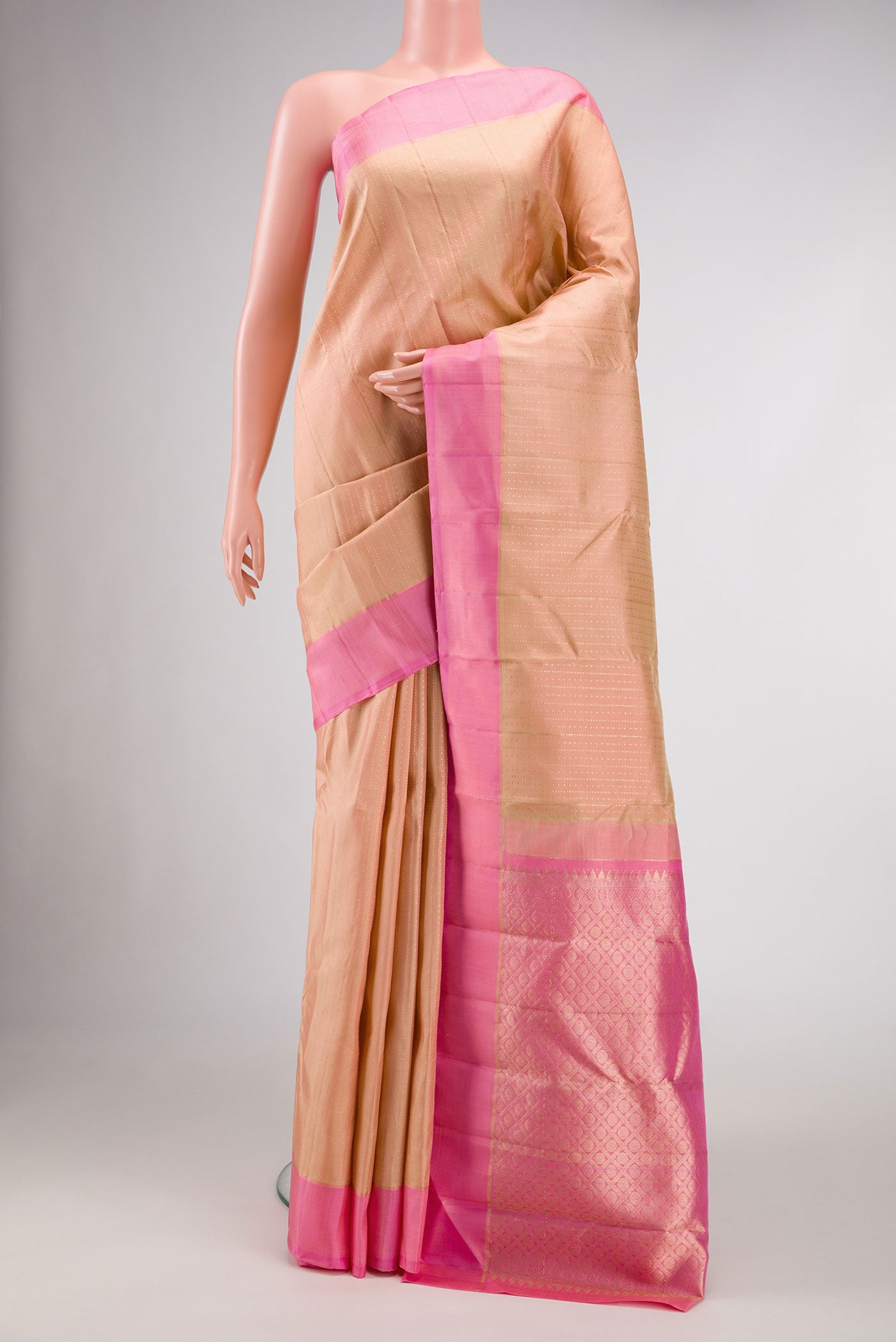 Sandal Dual Tone Kanchipuram Silk Saree with Checked design on the body and Plain Border.  displayed on a mannequin