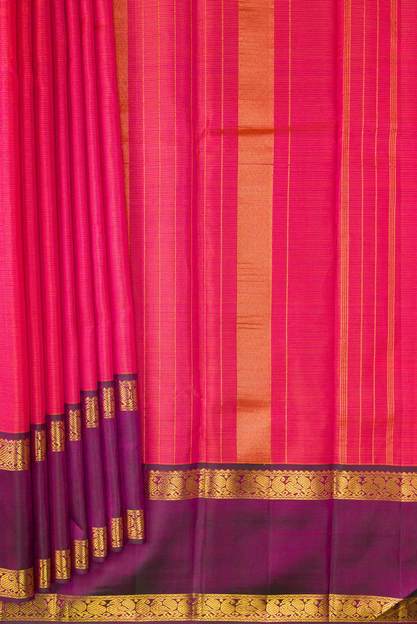 Pleats and pallu of Brick Orange Dual Tone Kanchipuram Silk Saree with Stripes on the body and Zari Border. 